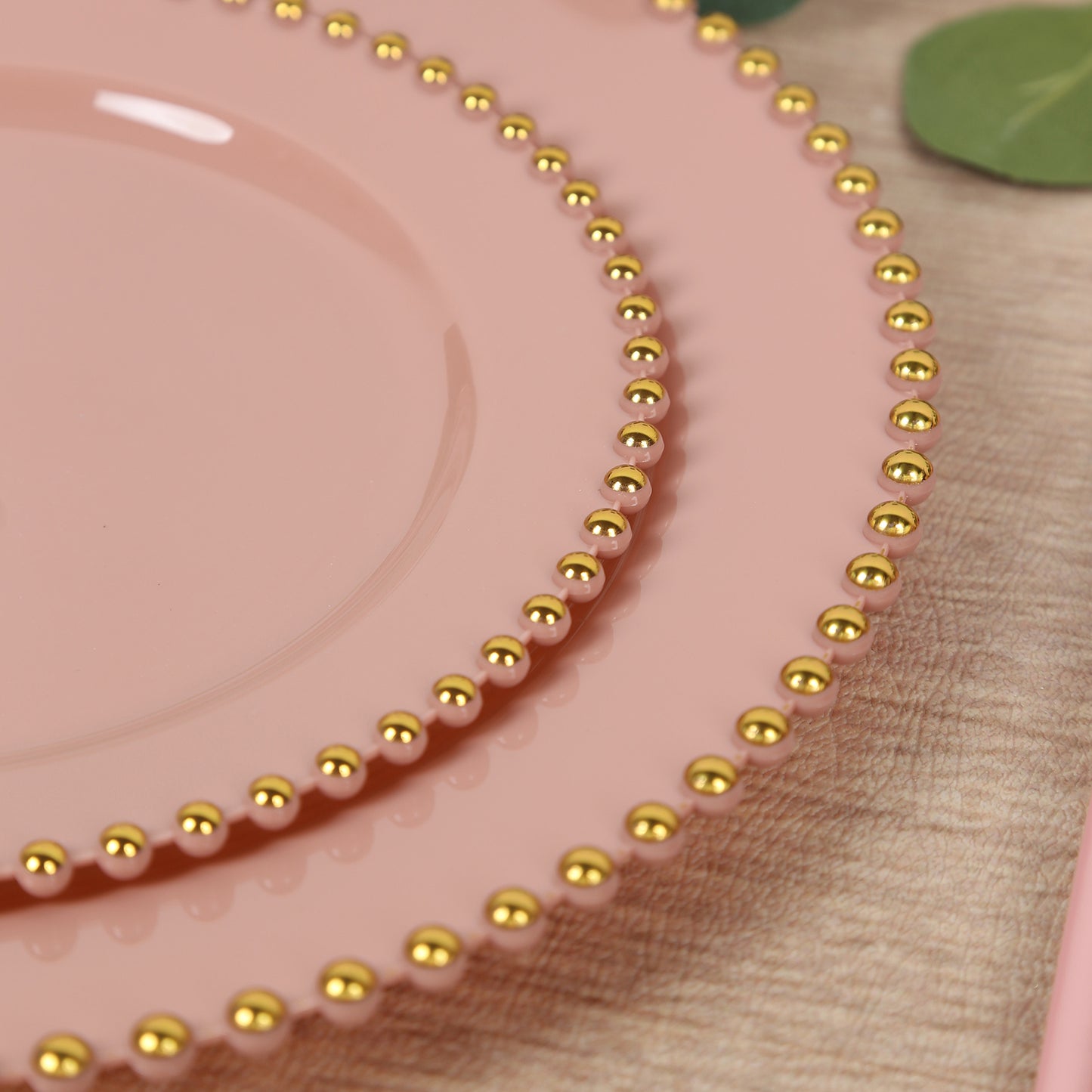 Dusty rose dessert plates with gold beaded rim, perfect for parties.
