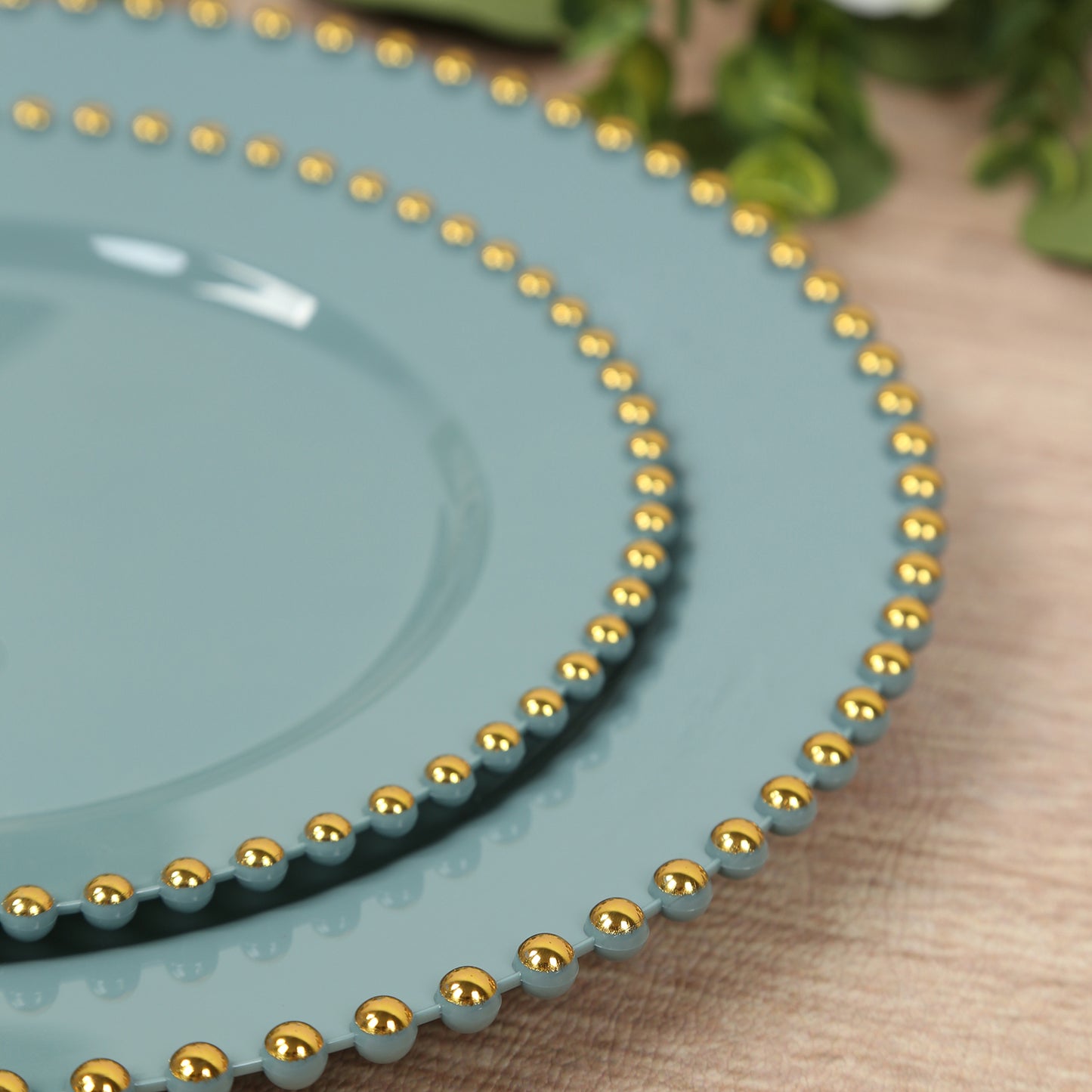 Dusty blue disposable dessert plates with gold beaded rim.
