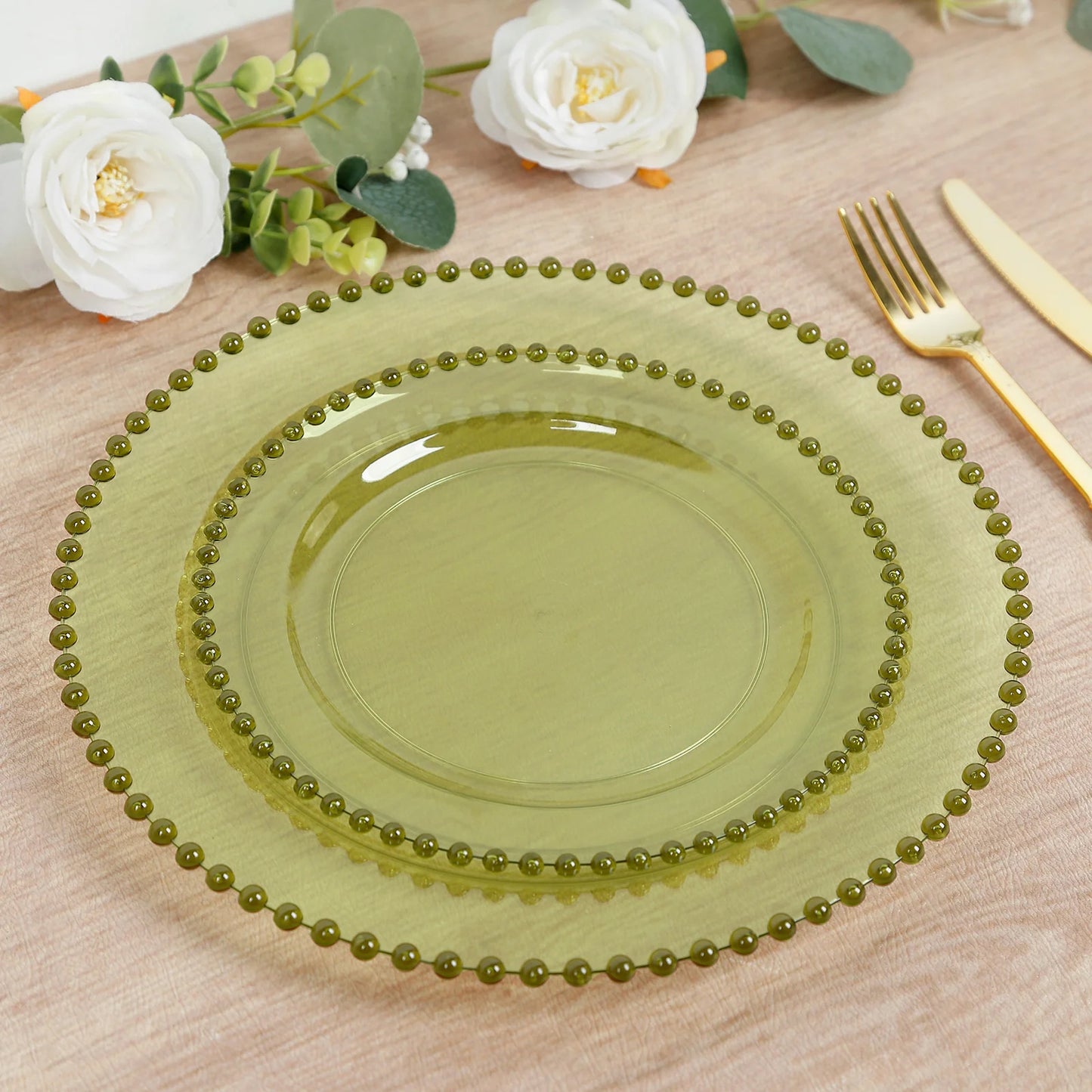 Transparent dusty sage green plastic dessert plates with beaded rim.