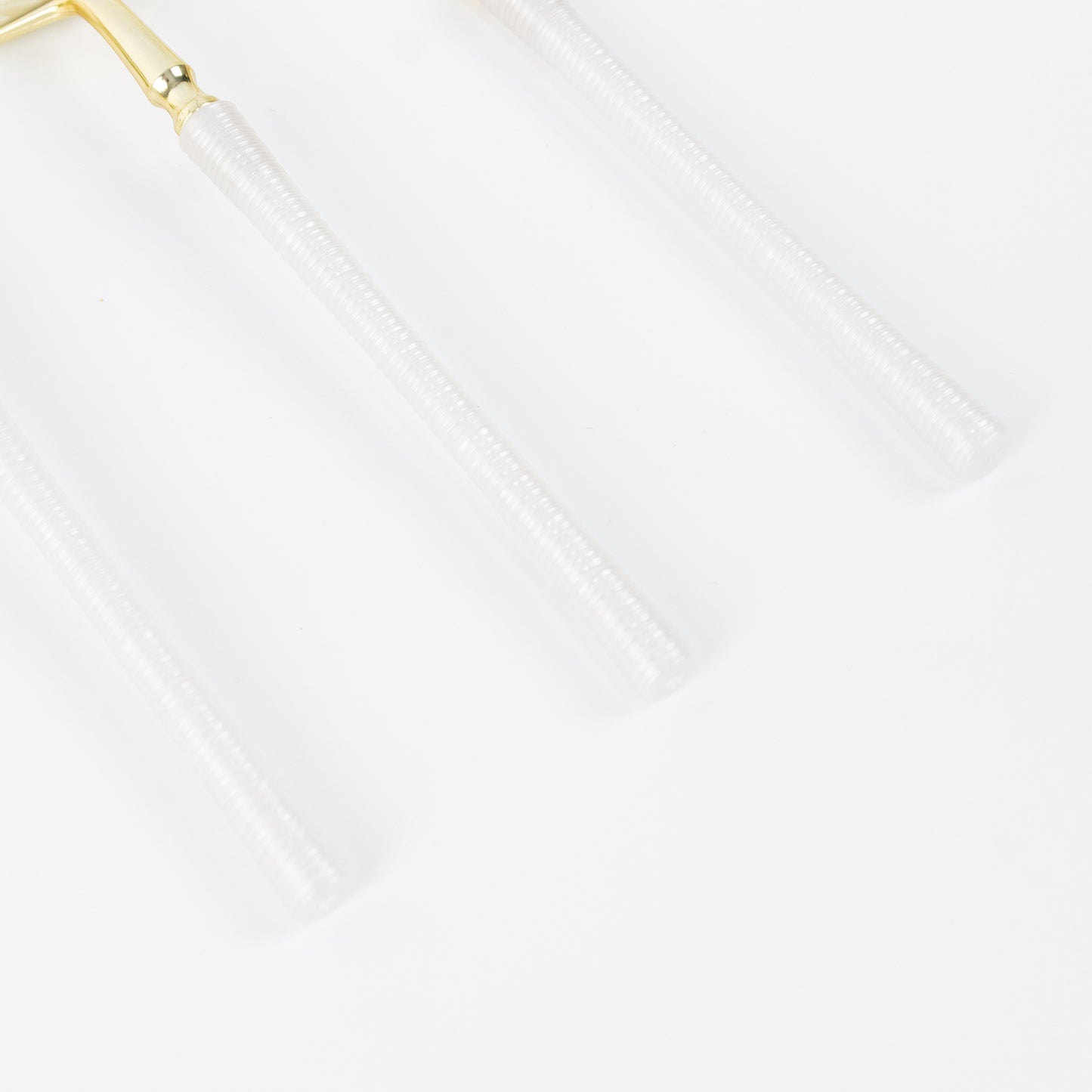 Gold and white plastic cutlery set, modern minimalist design, heavy duty disposable.