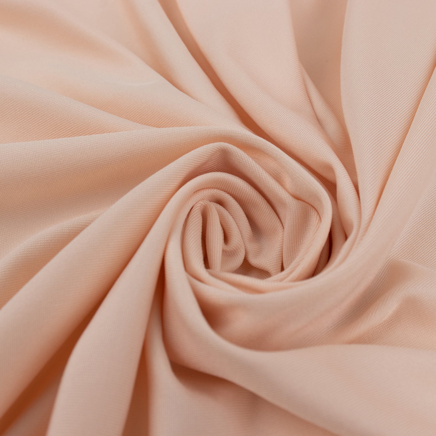 Blush spandex 4-way stretch fabric roll, perfect for DIY crafts.