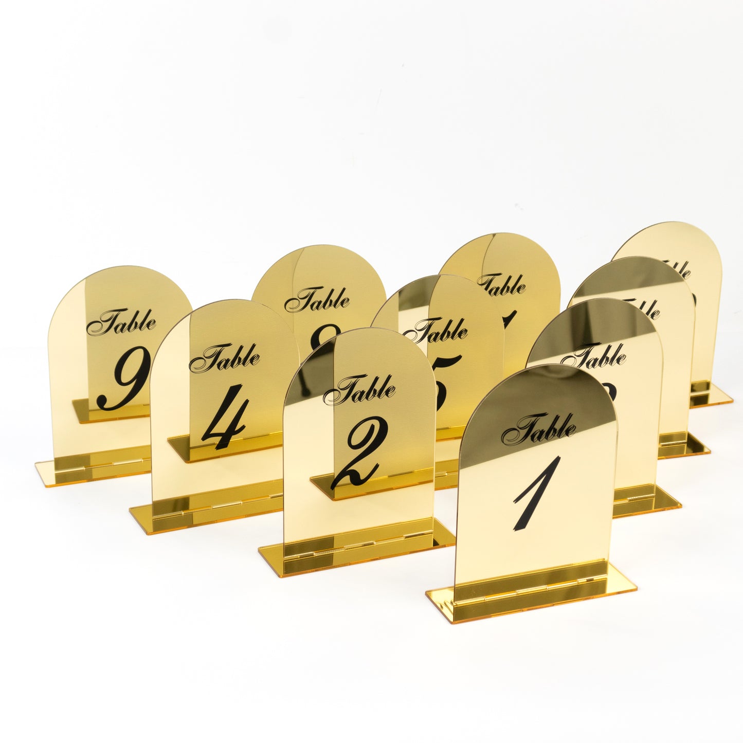 Gold mirror arch table numbers 1-10 with black print and stands.