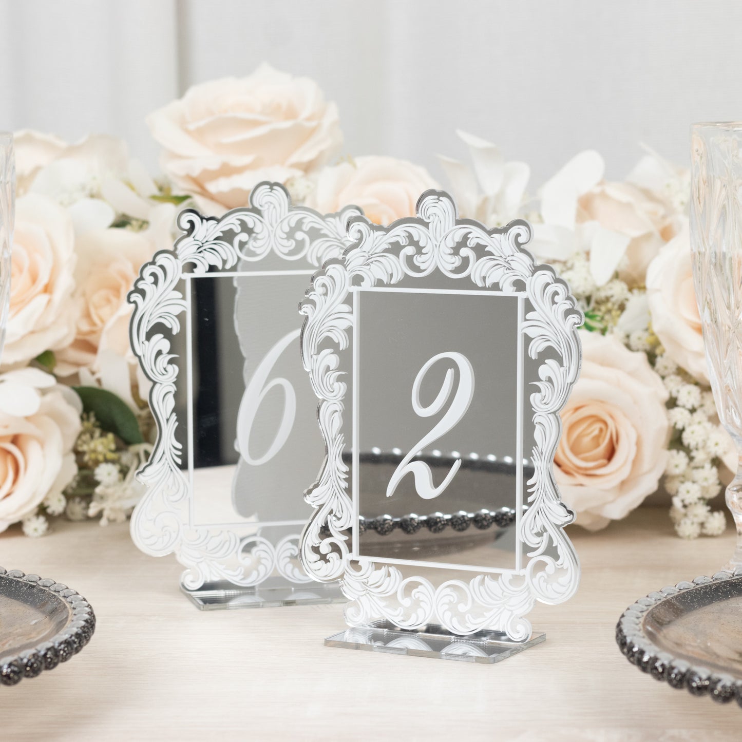 Silver mirror arch acrylic table numbers with white print and ornate border.