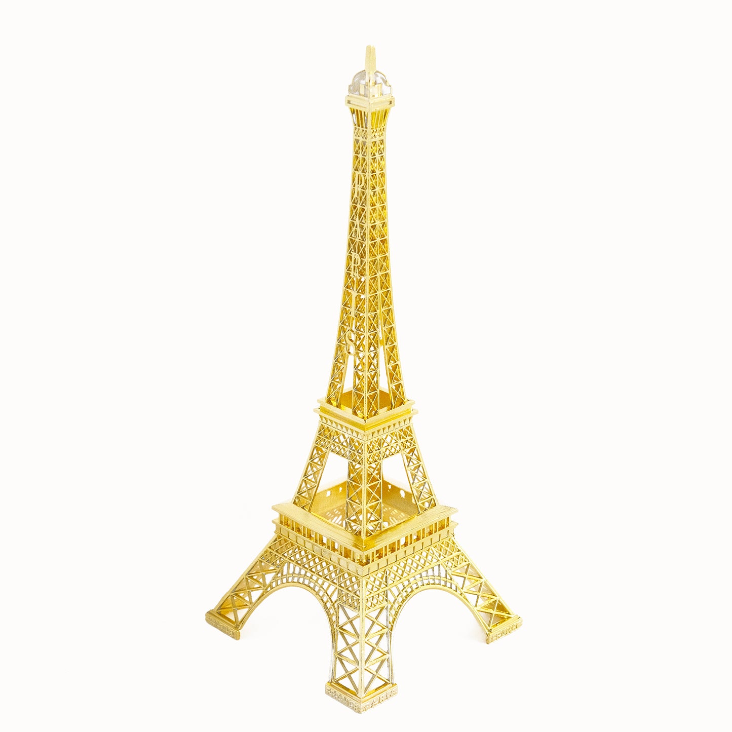 Gold metal Eiffel Tower centerpiece for table decor or cake topping.