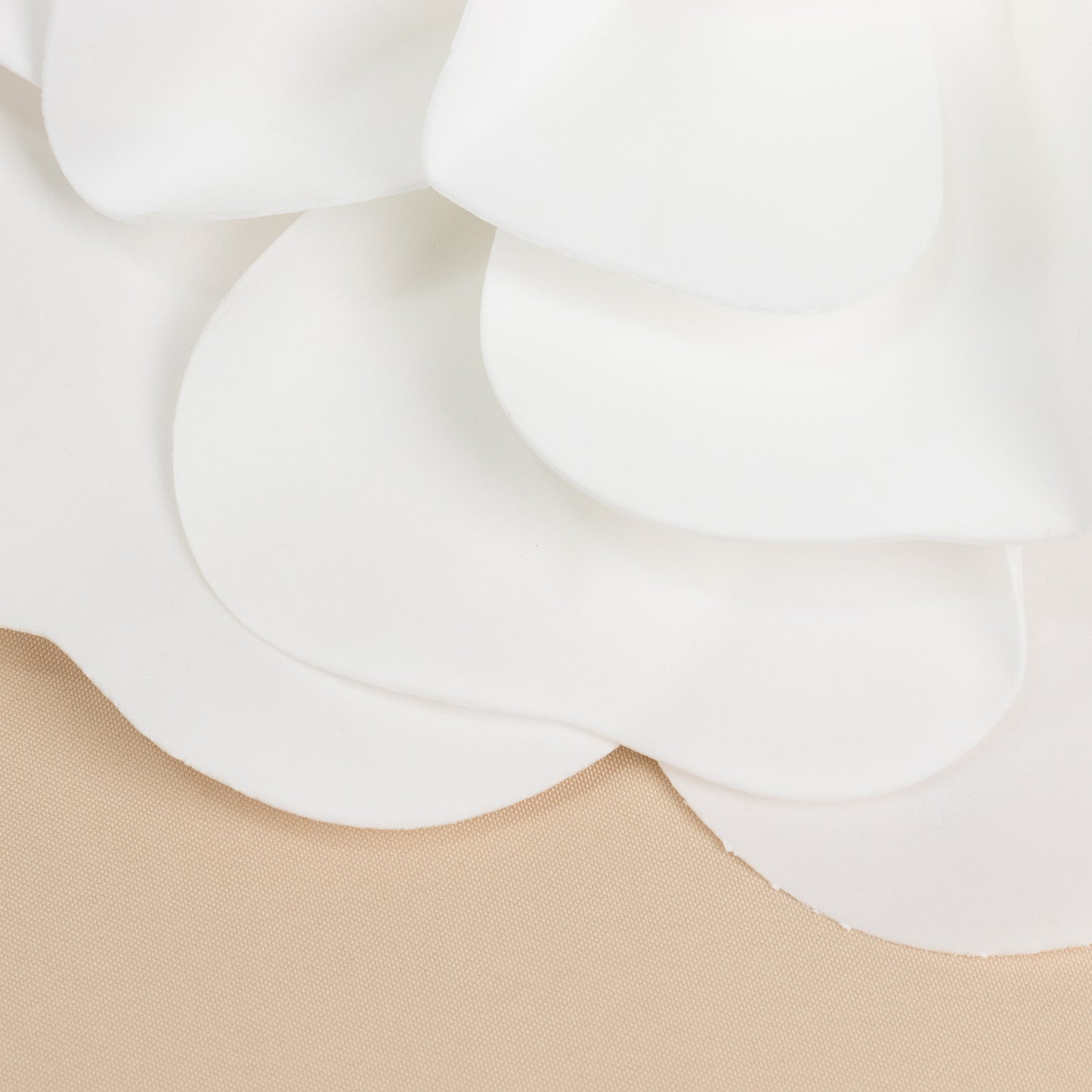 White artificial foam roses for DIY crafts.