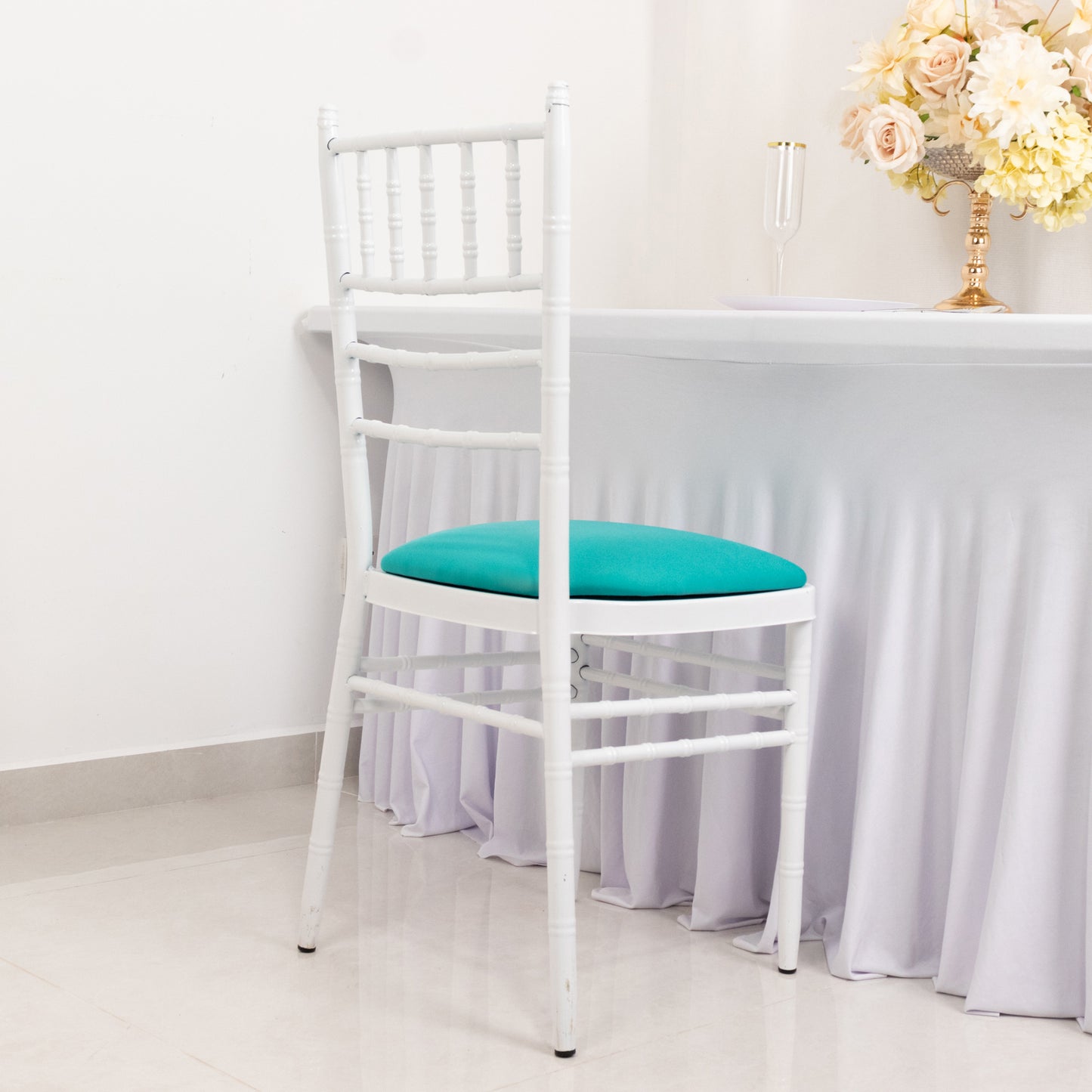 Turquoise spandex seat pad slipcover for Chiavari chair.