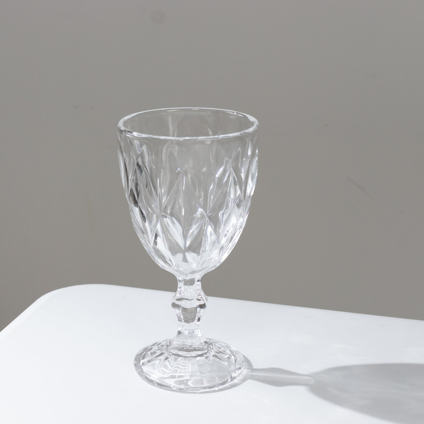 Clear embossed crystal cut wine glass goblet for parties and events.