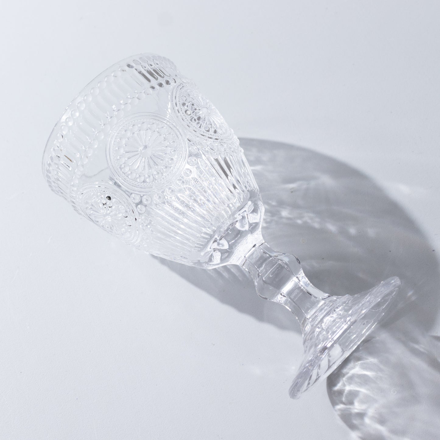 Clear vintage goblet with floral design, perfect for cocktails and wine.