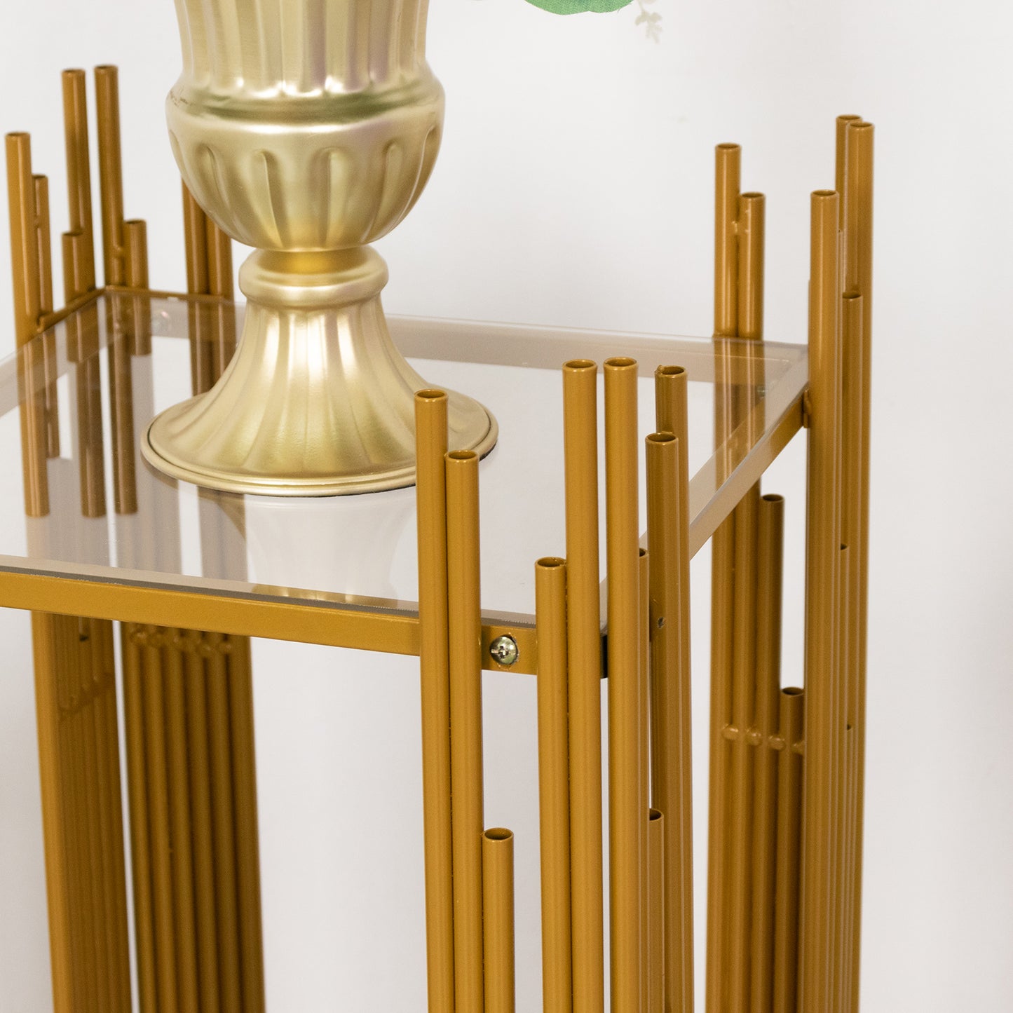 Gold metal pedestals with acrylic plates for cake or flower displays.