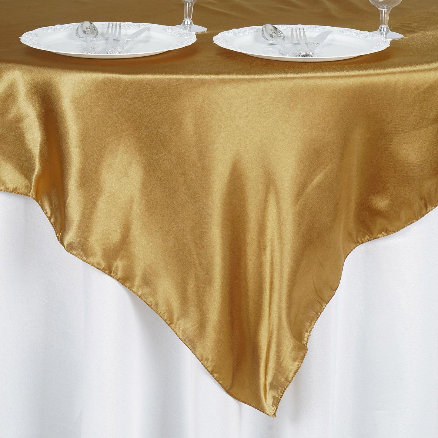 Gold square satin table overlay.