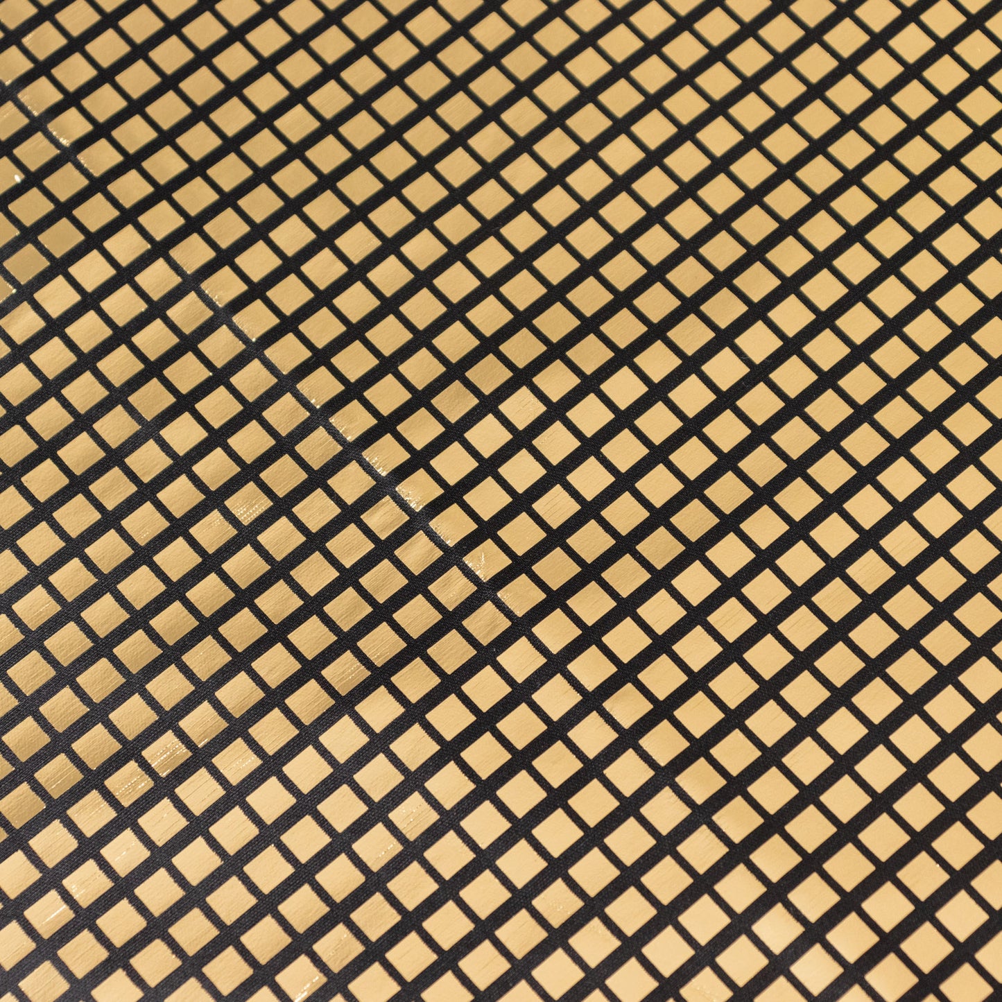 Shiny black and gold foil polyester table overlay, disco mirror ball theme.