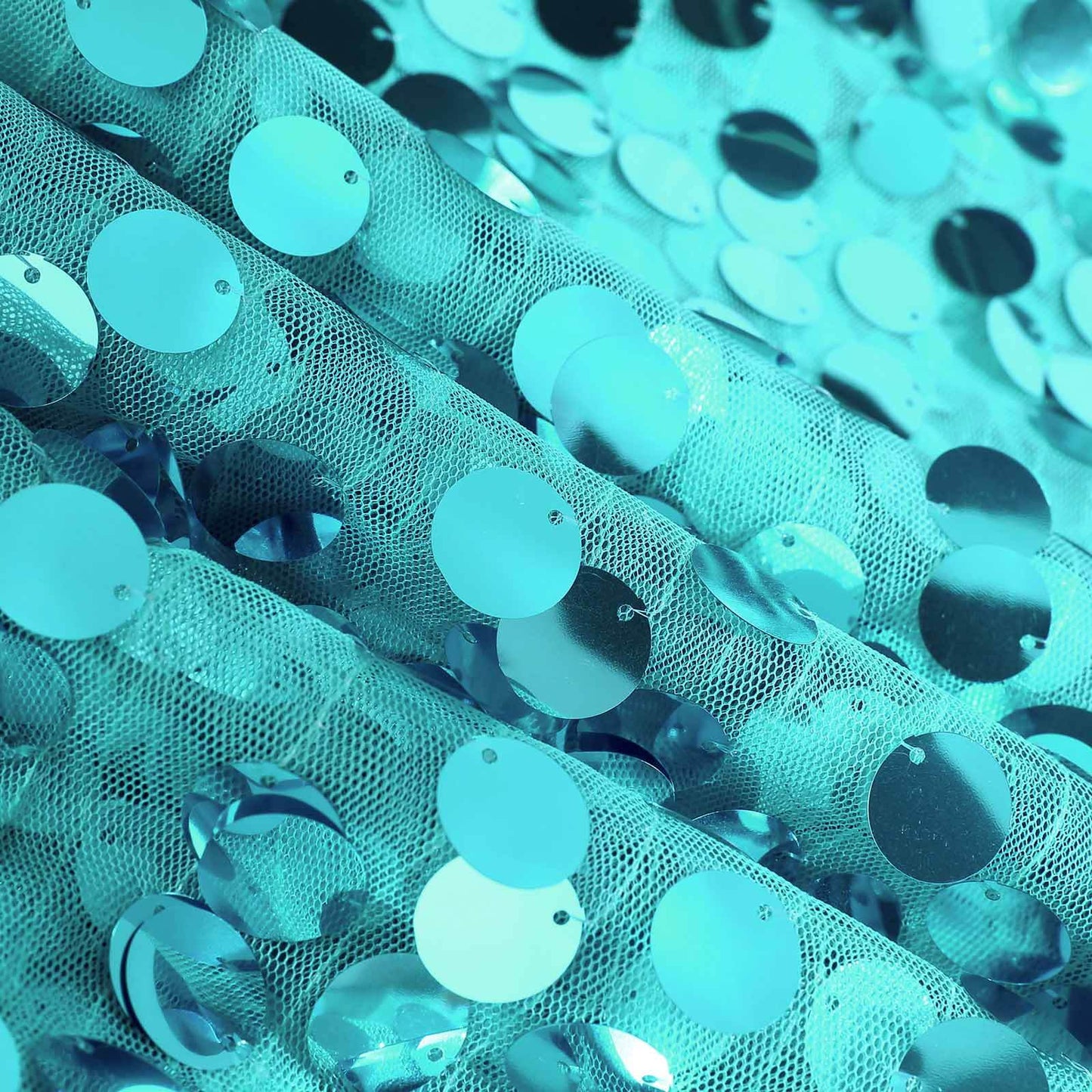 Turquoise sequin table overlay with big payette design. #whtbkgd