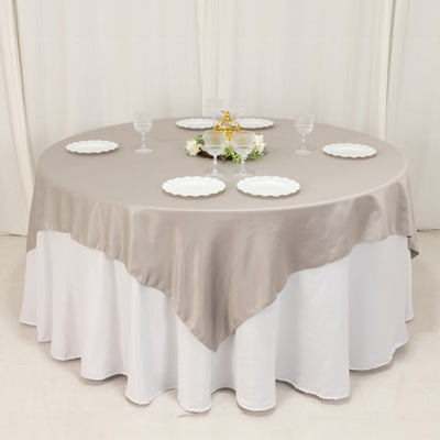 Sophisticated Charm with Silver Lamour Satin Table Overlay Sophisticated Charm with Silver Lamour Satin Table Overlay