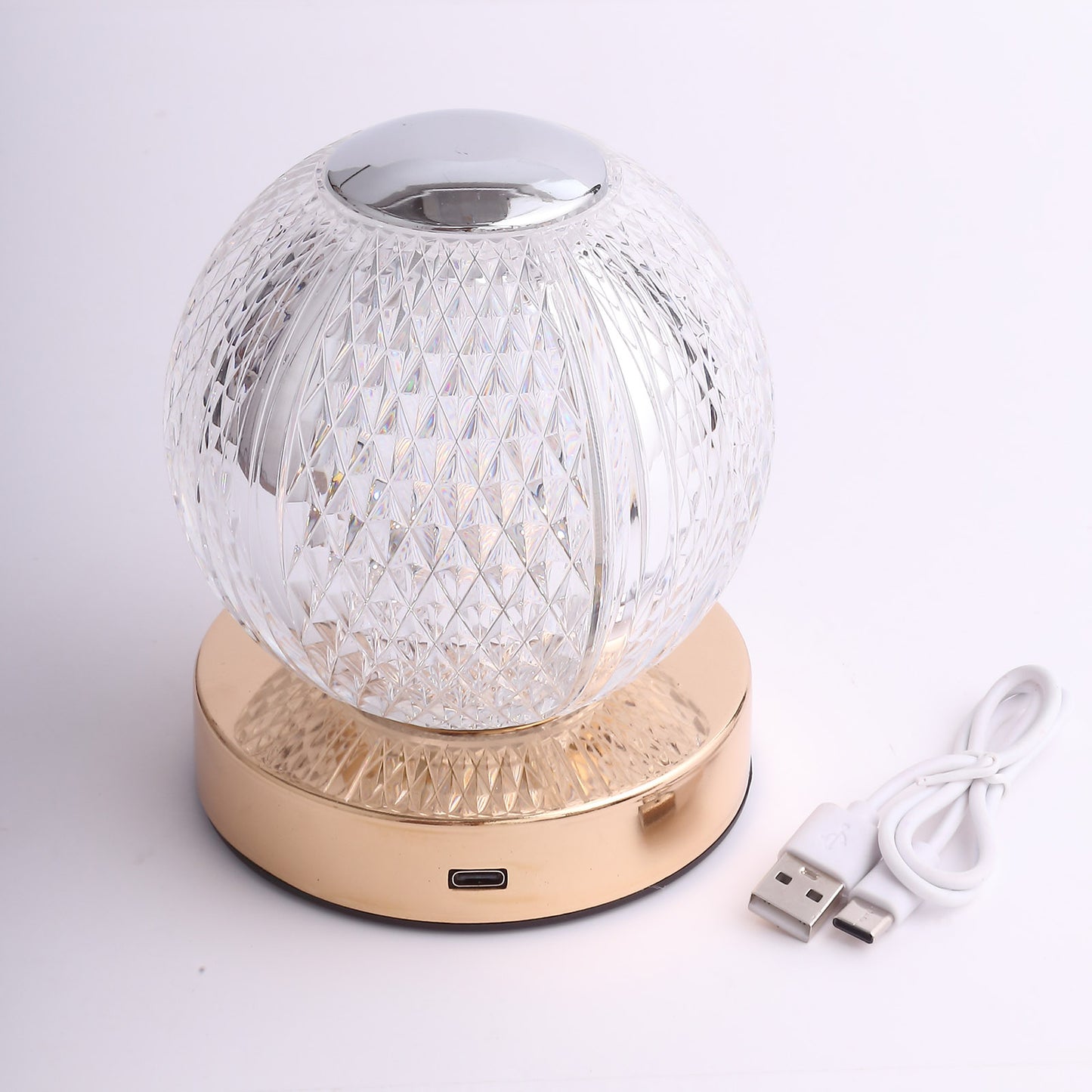 Dimmable LED crystal ball lamp with gold base, touch control, and rechargeable design.