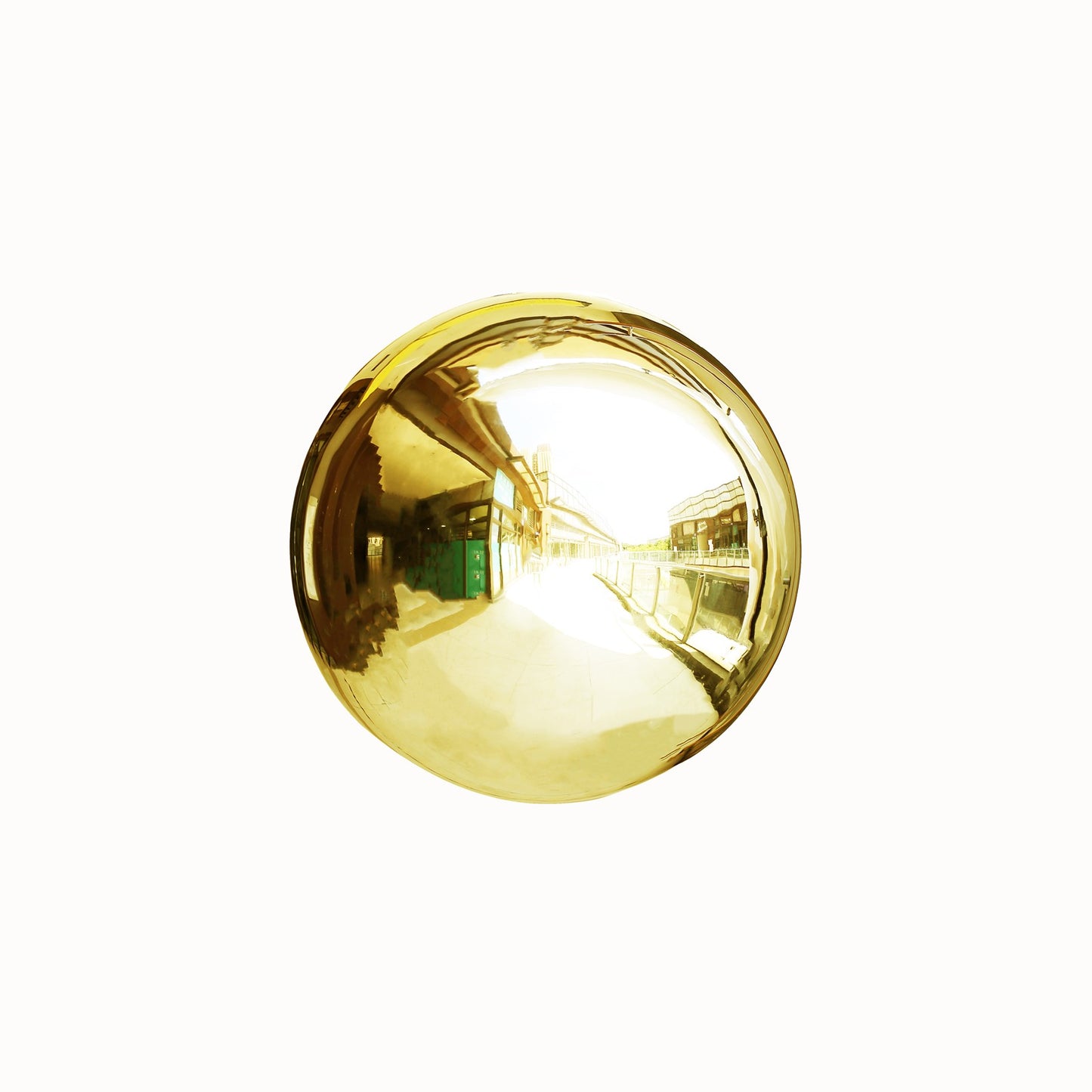 Gold reflective garden globe sphere for outdoor decor.