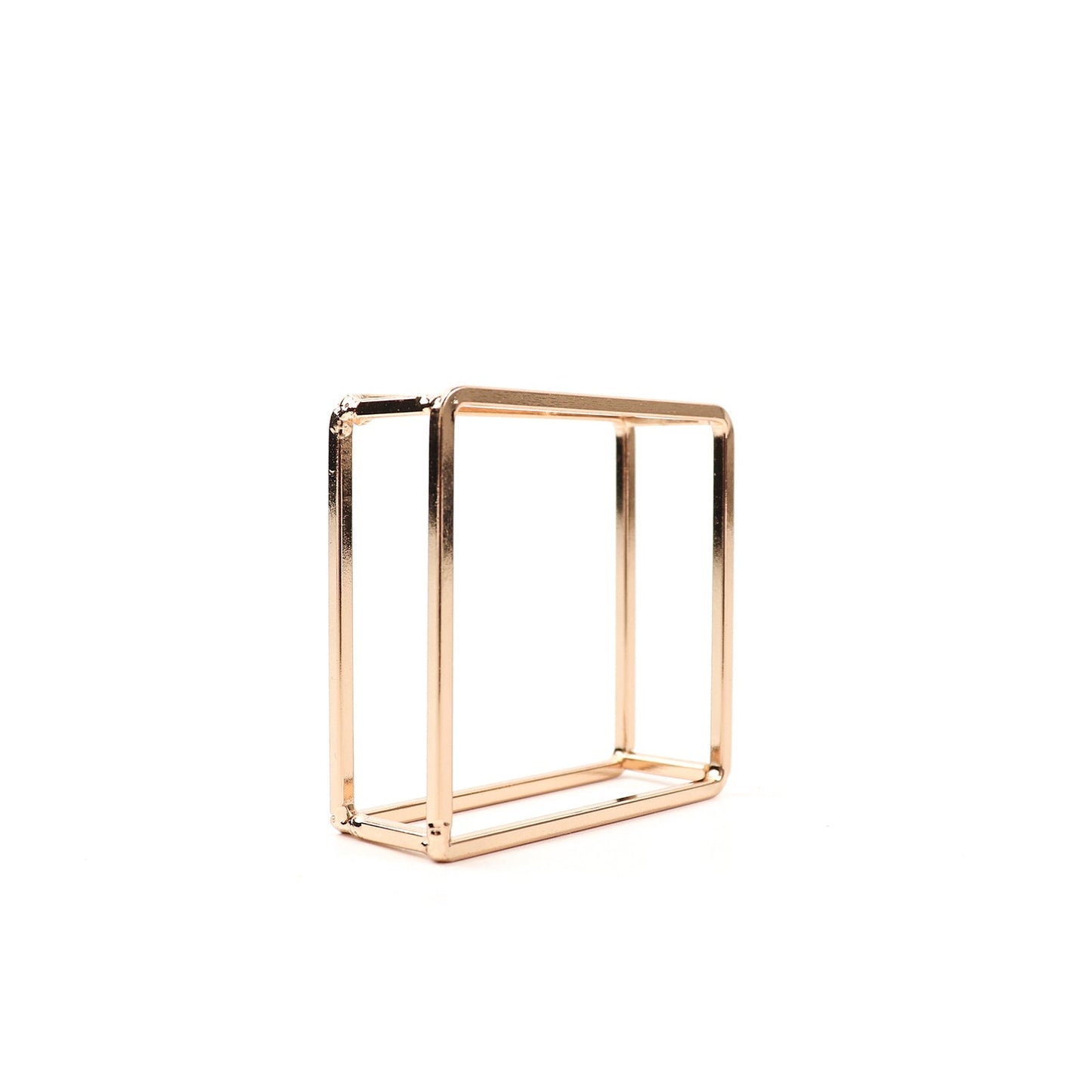 Gold metal hollow square napkin ring holder, modern geometric design.
