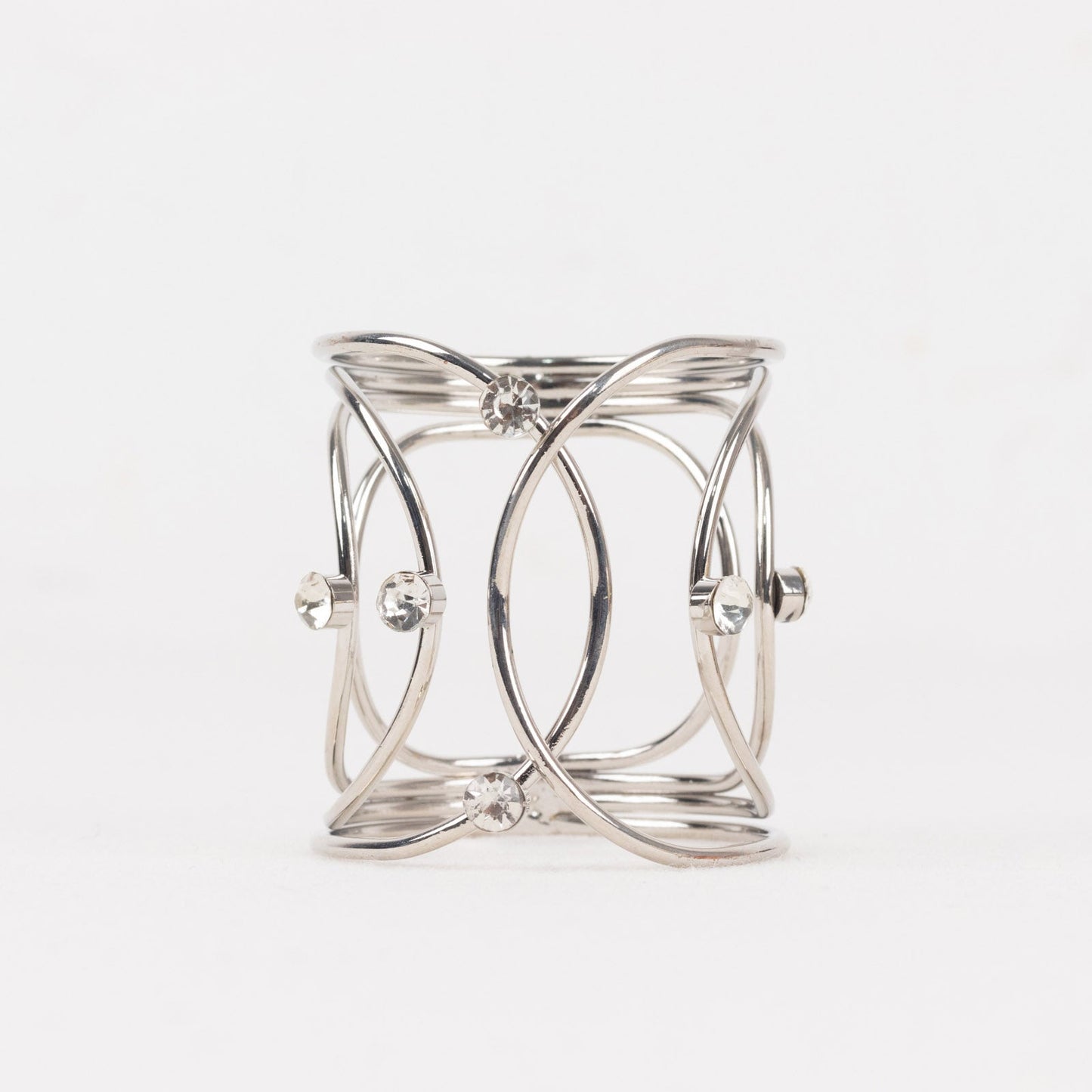 Silver metal napkin ring with rhinestones in hollow woven style.