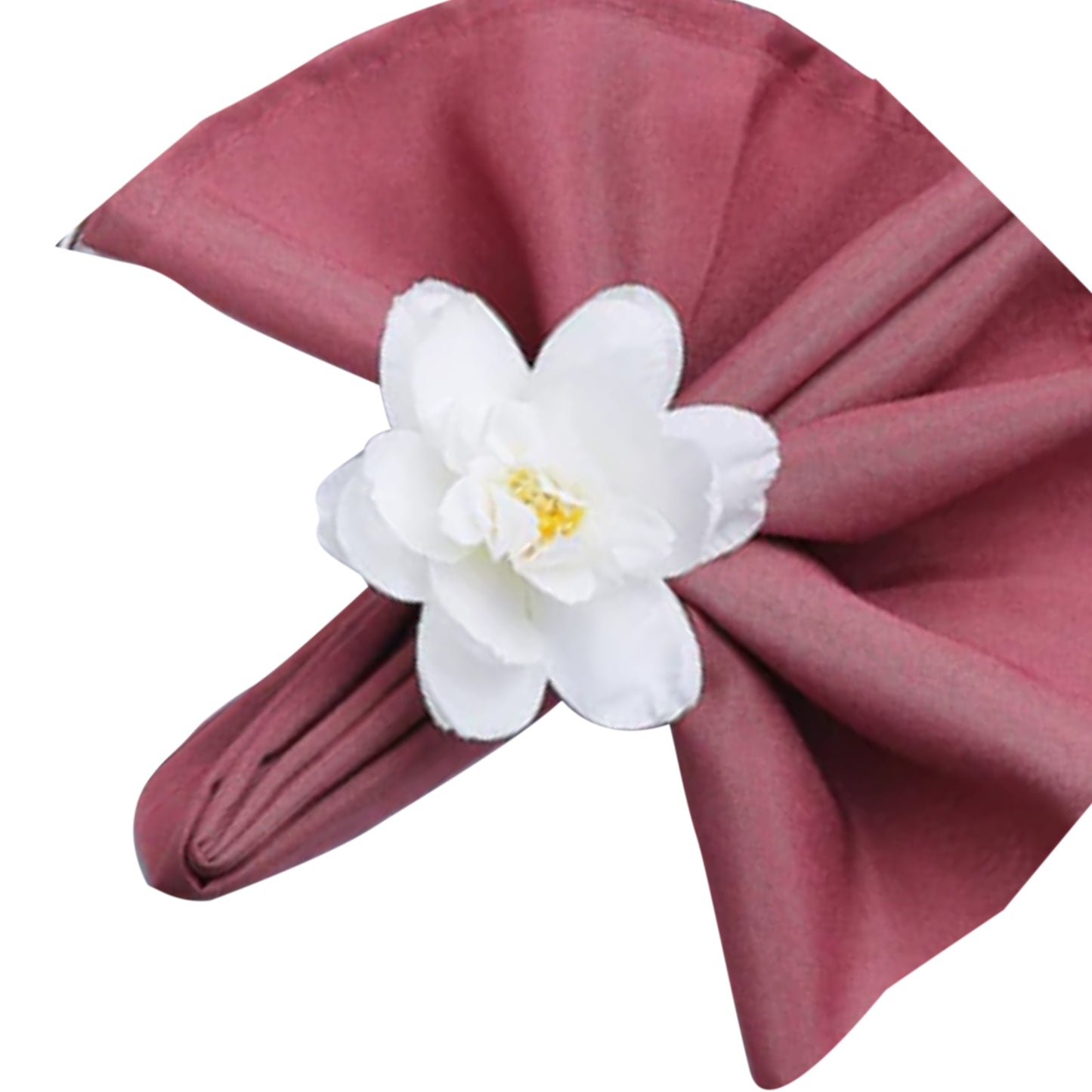 White silk napkin ring with artificial jasmine flower on a burgundy napkin.