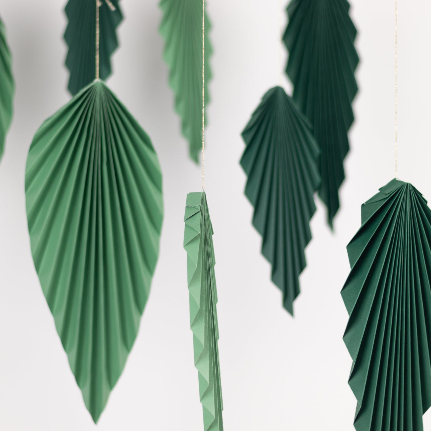 Set of 6 mixed green leaves hanging paper fans backdrop decor.