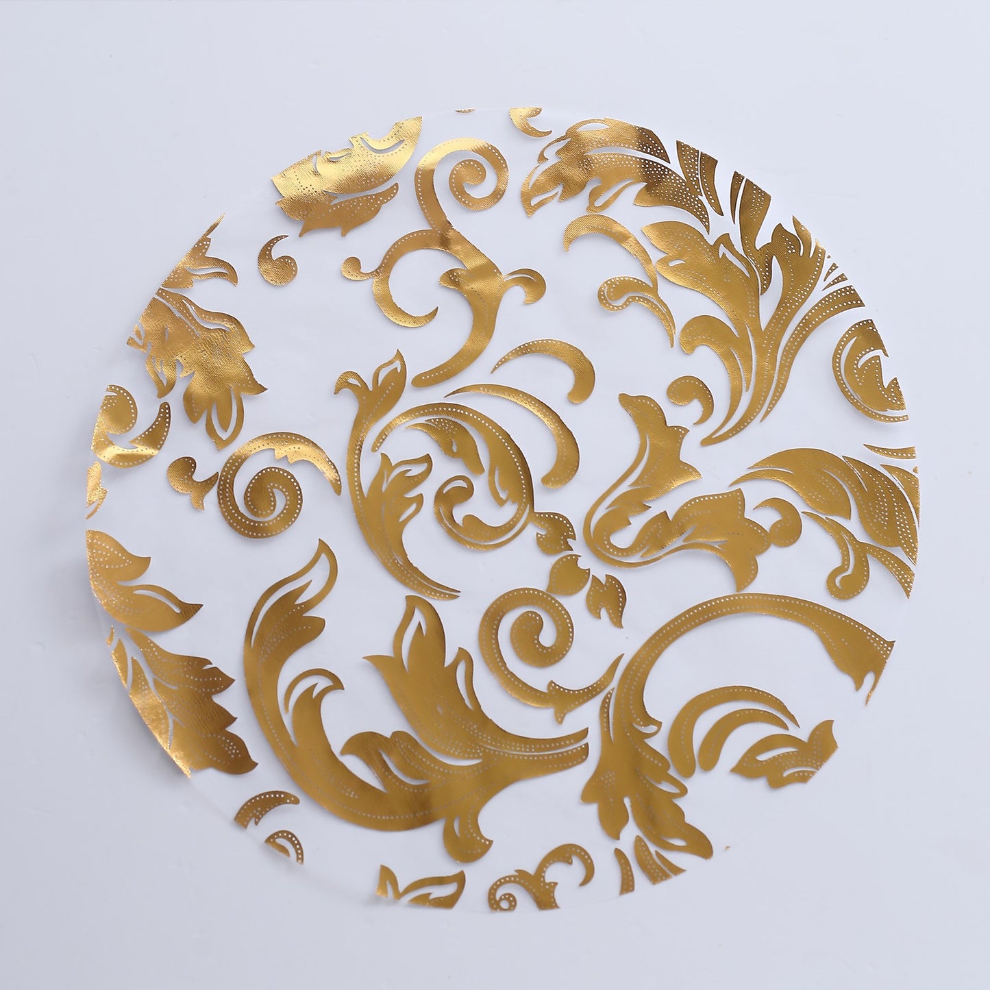 Metallic gold swirl foil floral design round placemat.