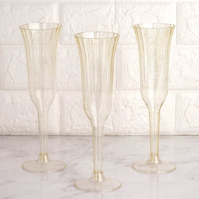 Clear with Gold Glitter Plastic Champagne Flutes 6oz Clear with Gold Glitter Plastic Champagne Flutes 6oz