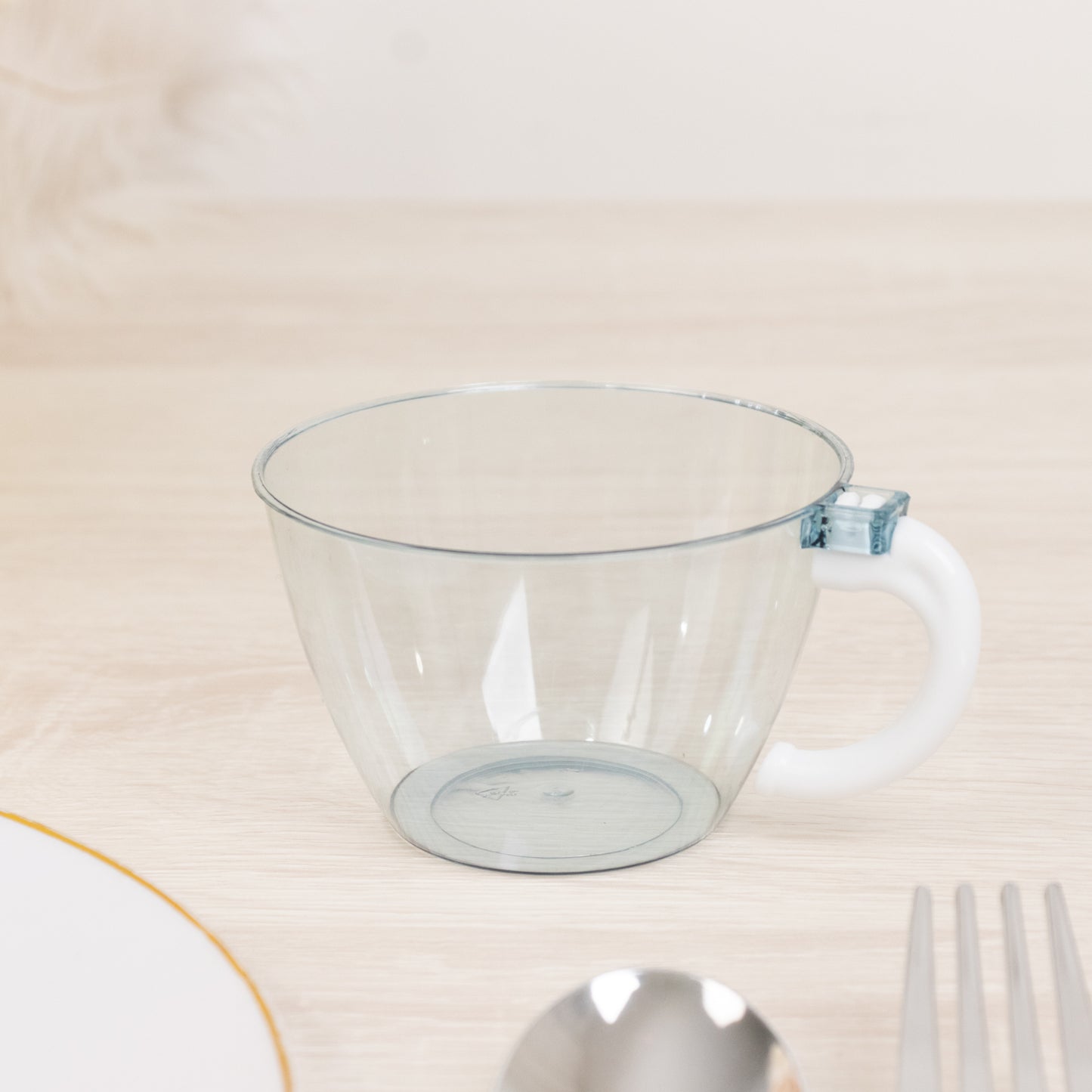 6oz transparent dusty blue disposable coffee cup with handle.
