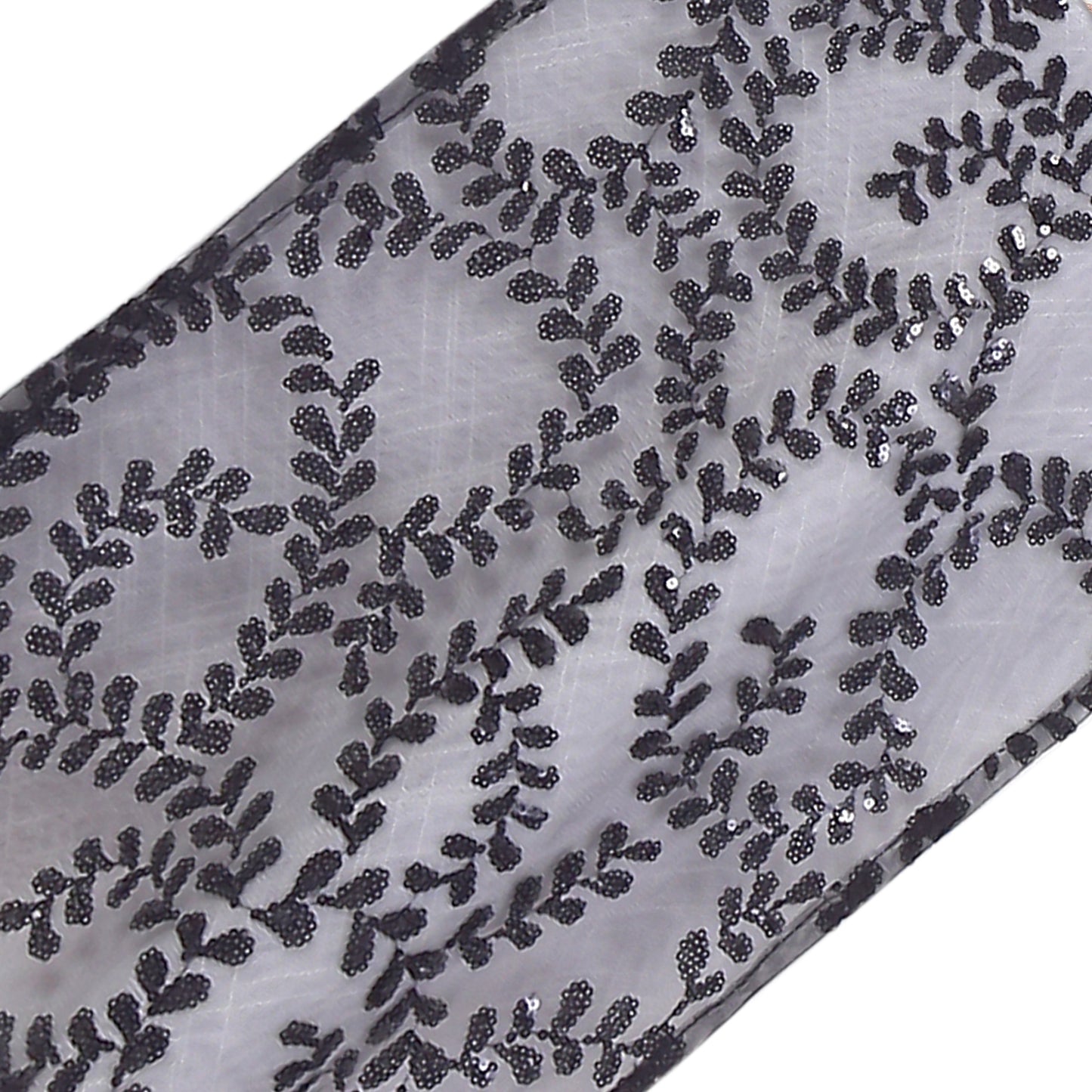 Sparkly black leaf vine sequin tulle table runner on a white background. #whtbkgd