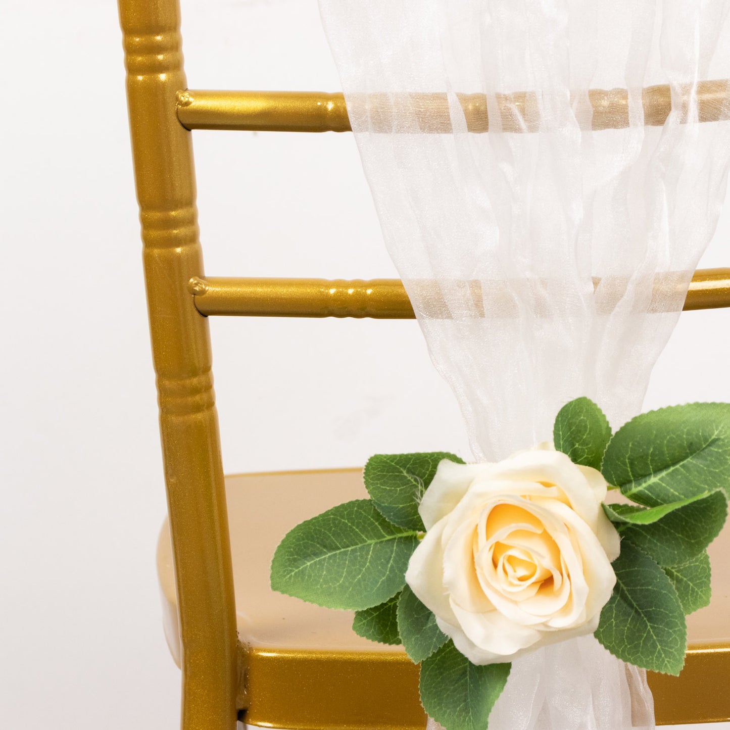 Champagne sheer crinkled organza chair sash on a gold chair