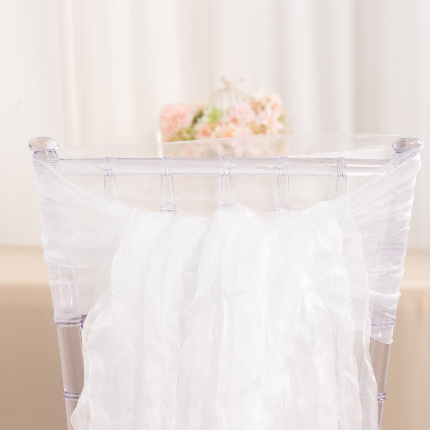 White sheer crinkled organza chair sashes for elegant decor.