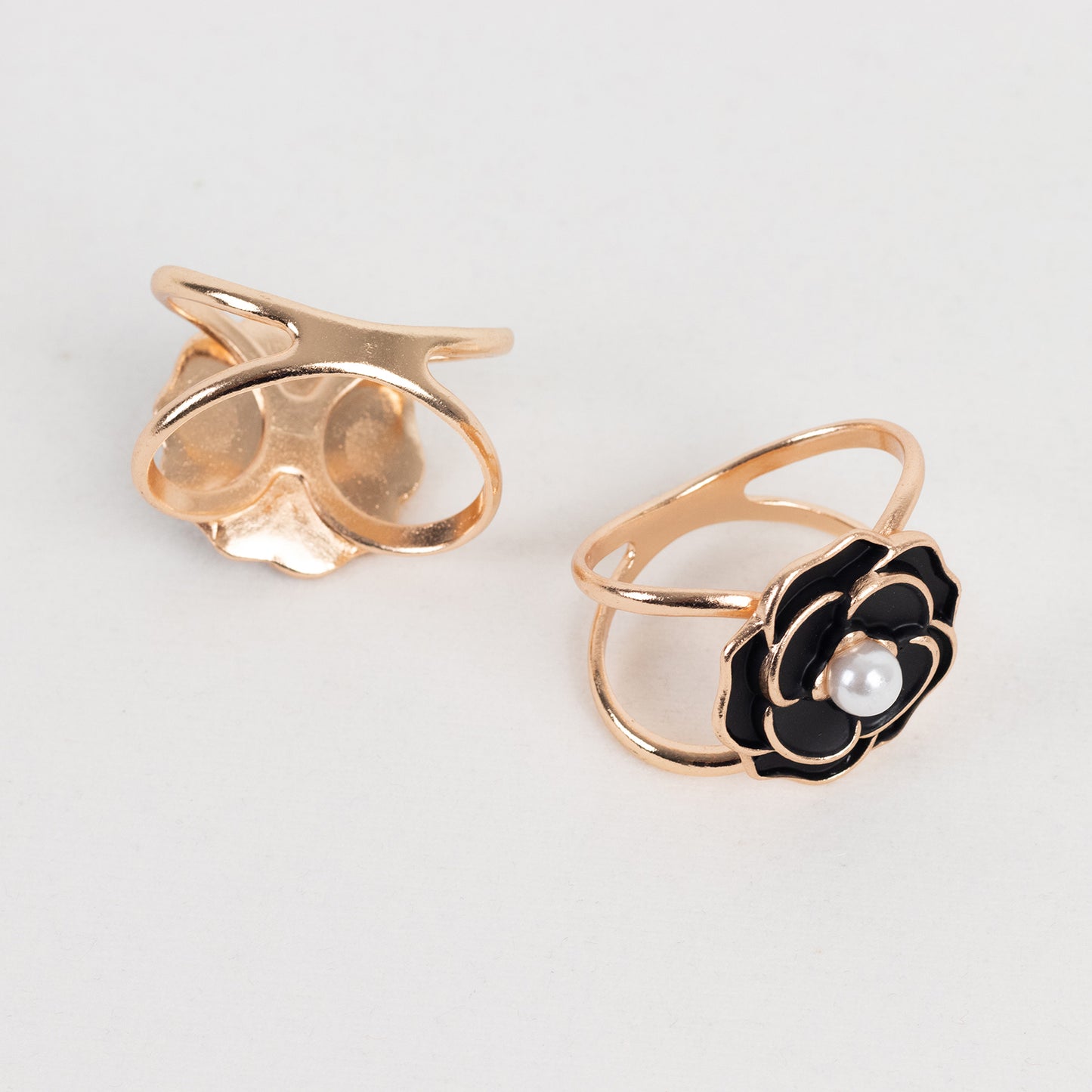 Black pearl floral metal chair sash bow pins with gold rim.