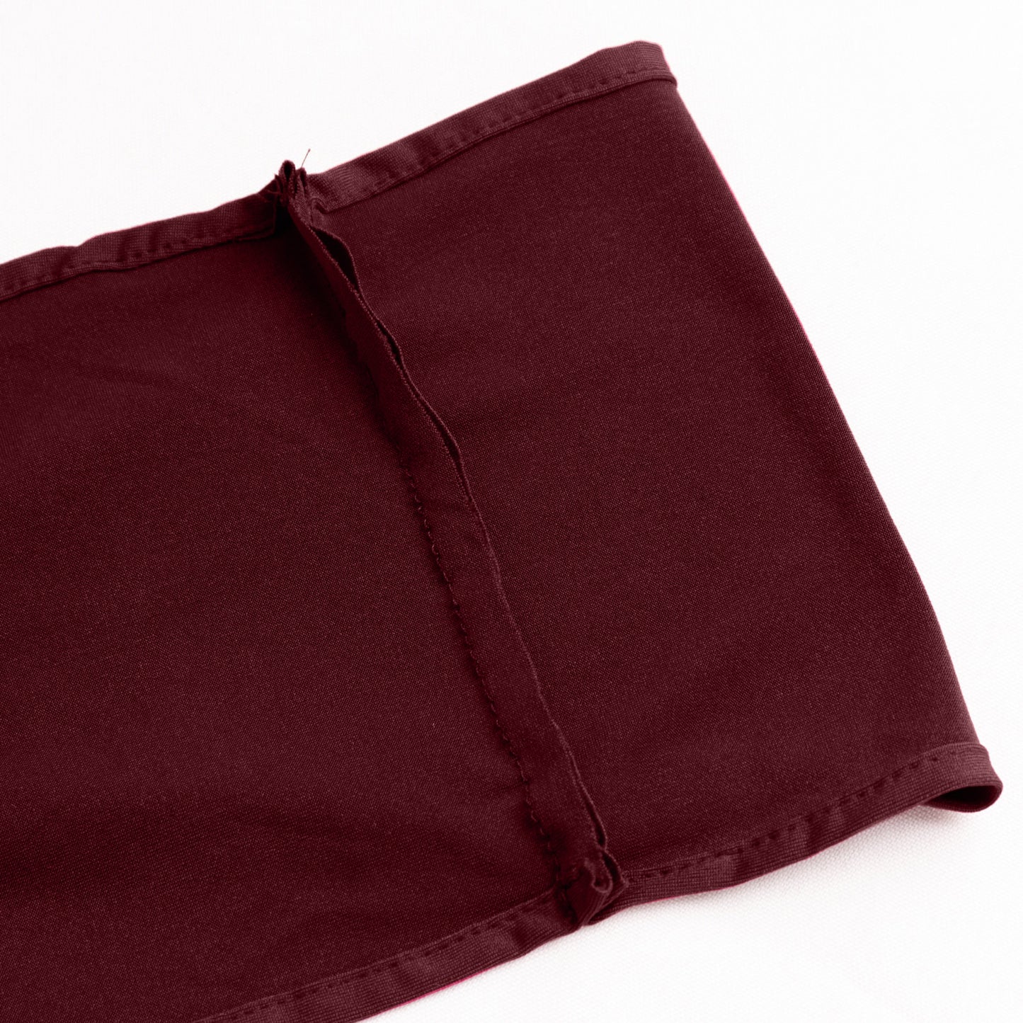 Burgundy spandex chair sash with gold diamond buckle detail.