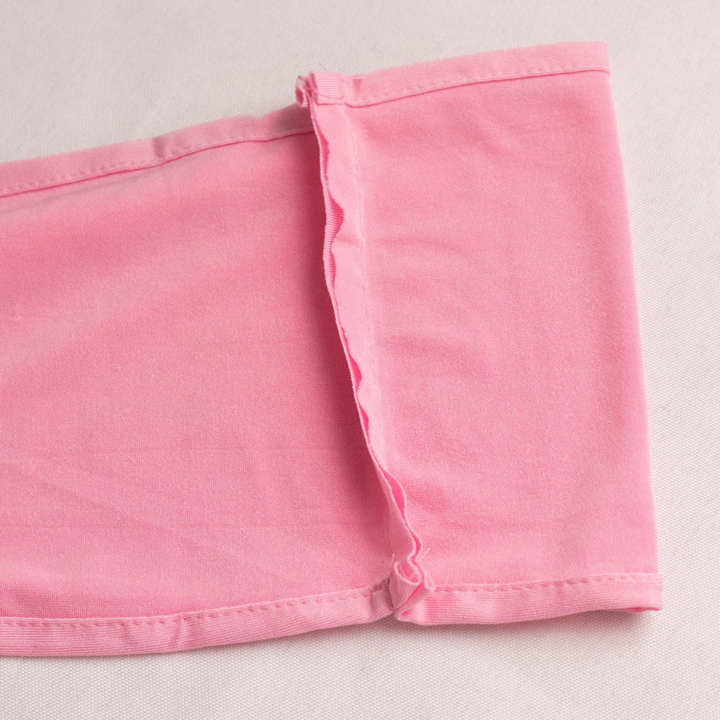 Pink spandex chair sash with gold diamond buckle, elegant and stretchy.