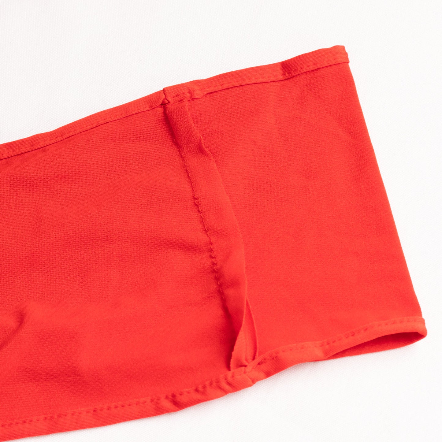 Red spandex chair sash with gold diamond buckle, elegant and stretchy design.