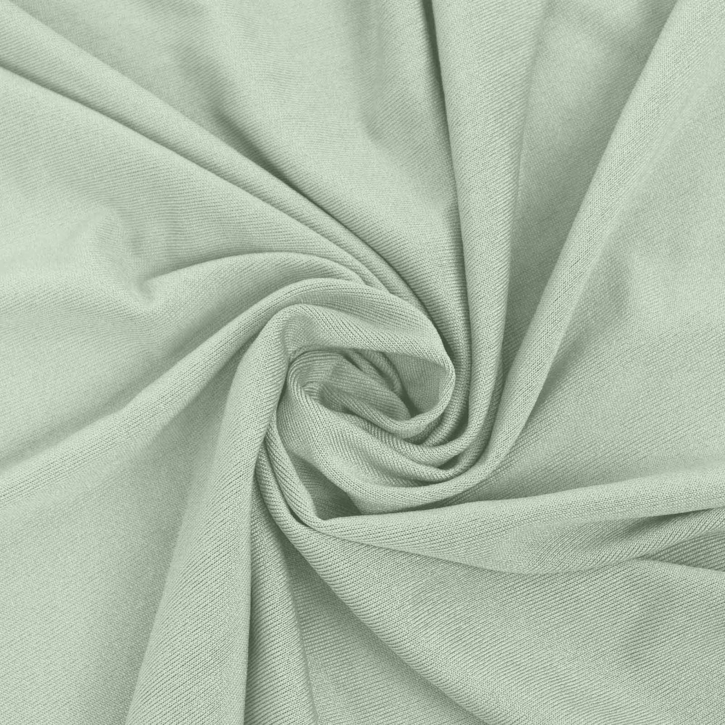 Sage green round cocktail table cover with natural wavy drapes.