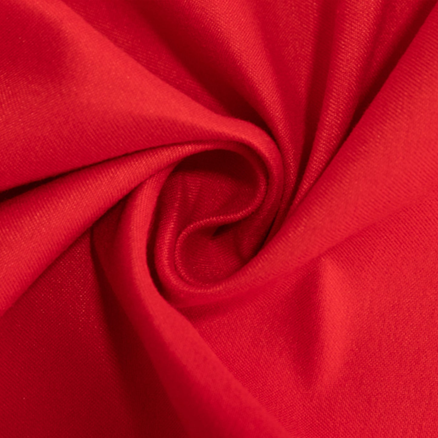 Red cotton blend round tablecloth fabric in a twisted design.