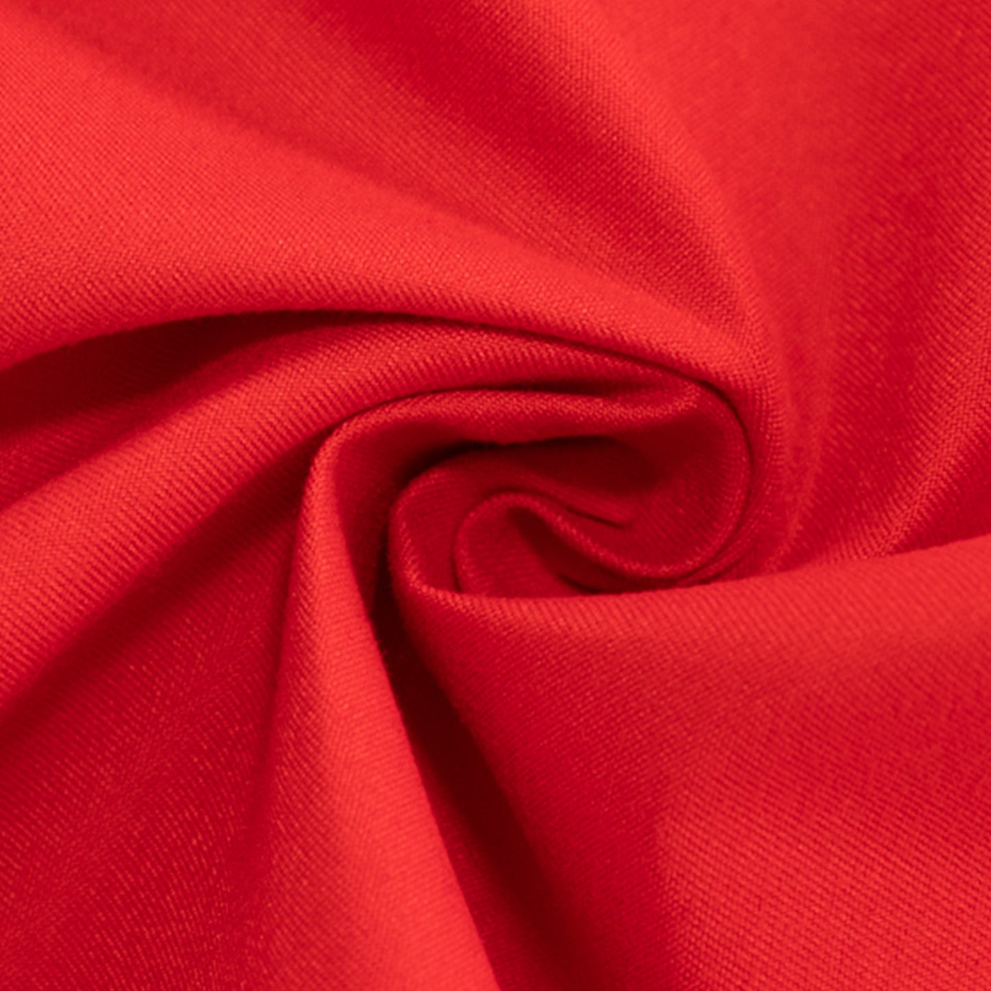 Red cotton blend round tablecloth, ideal for table settings.