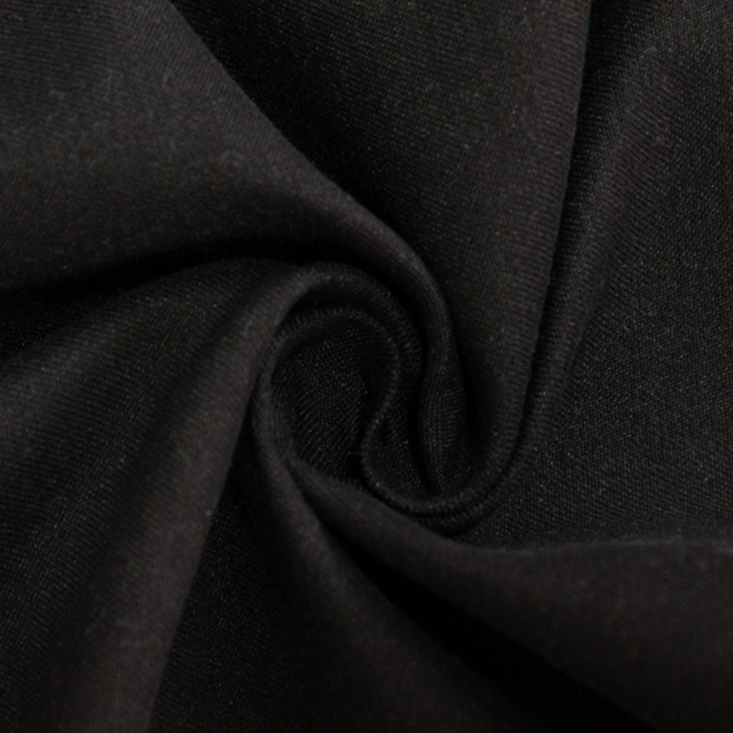 90" black cotton blend round tablecloth fabric close-up.