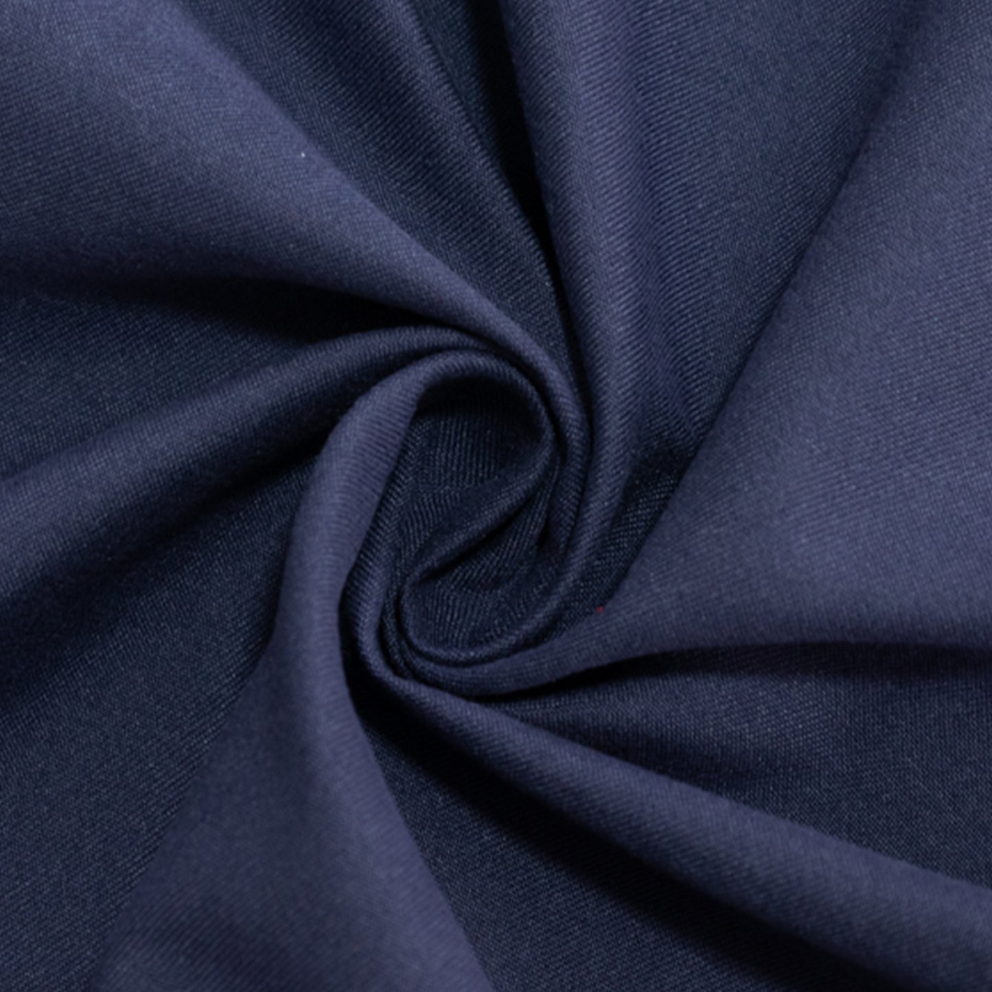 Navy blue cotton blend round tablecloth fabric close-up.