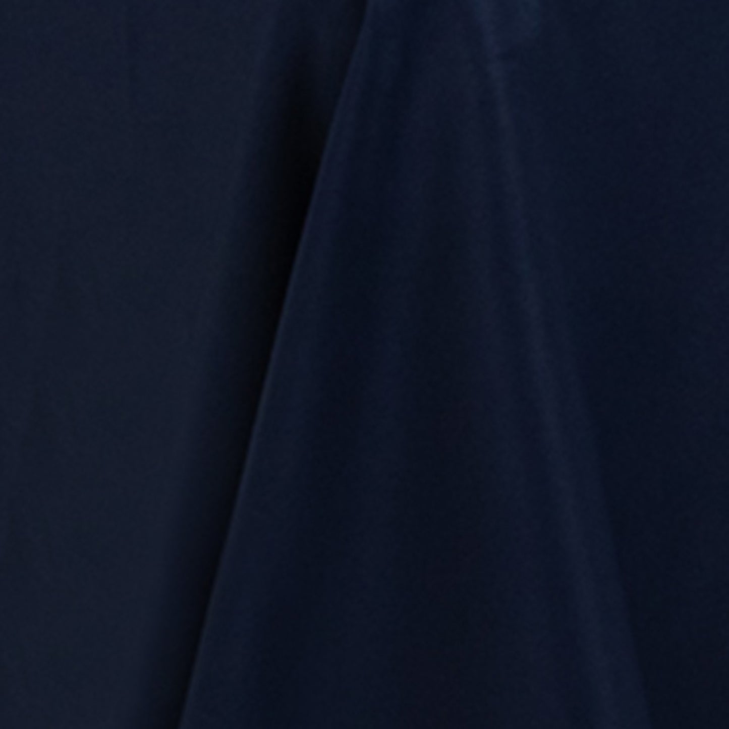 Navy blue round tablecloth made of premium fire retardant polyester.