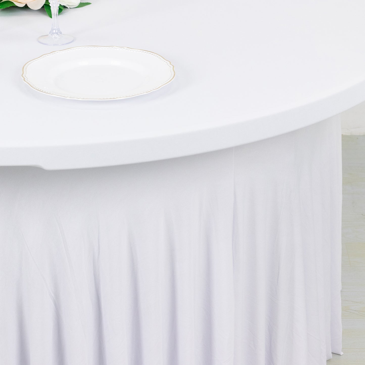 White wavy spandex fitted tablecloth skirt for 72-inch tables.
