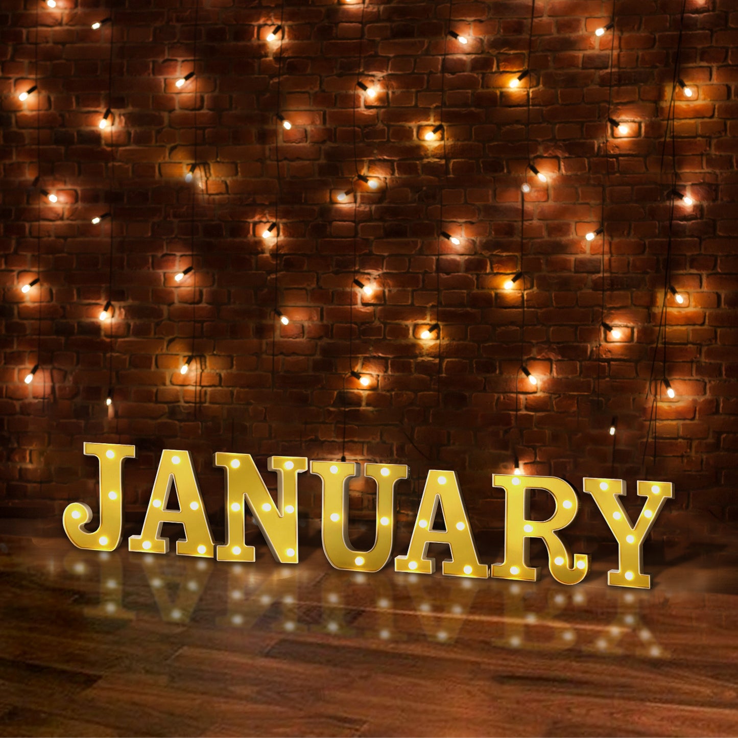 Gold 3D marquee letter "J" with warm white LED lights.