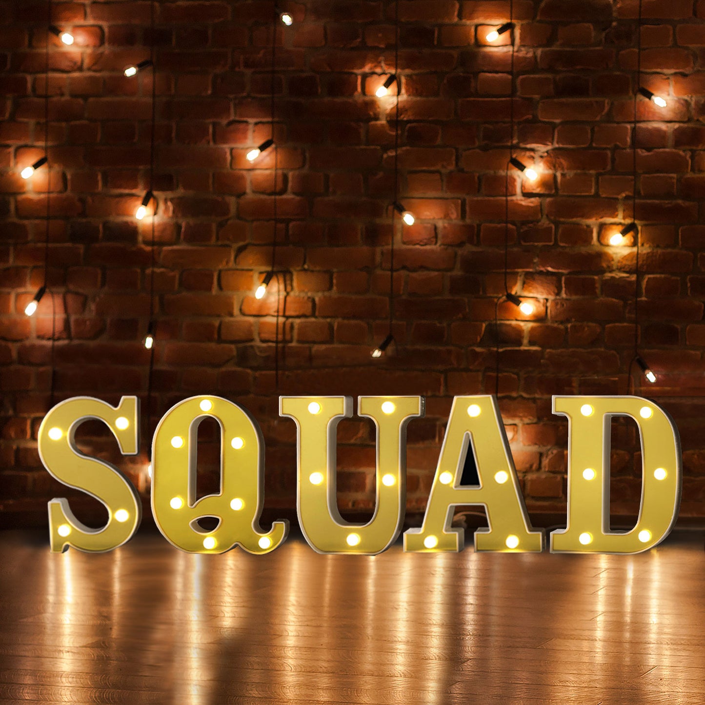 Gold 3D marquee letter "S" with warm white LED lights.