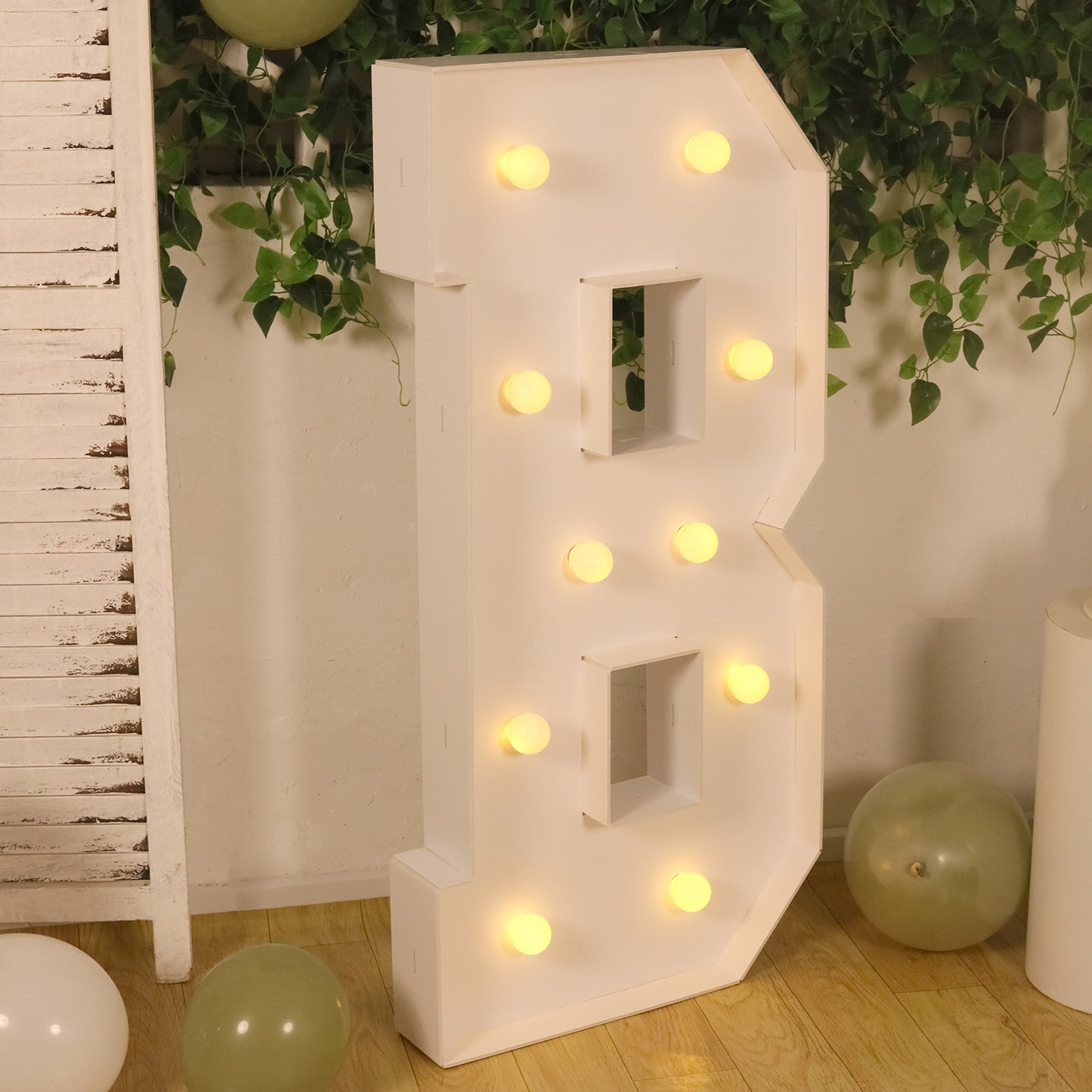 White LED marquee letter "B" with warm white lights.