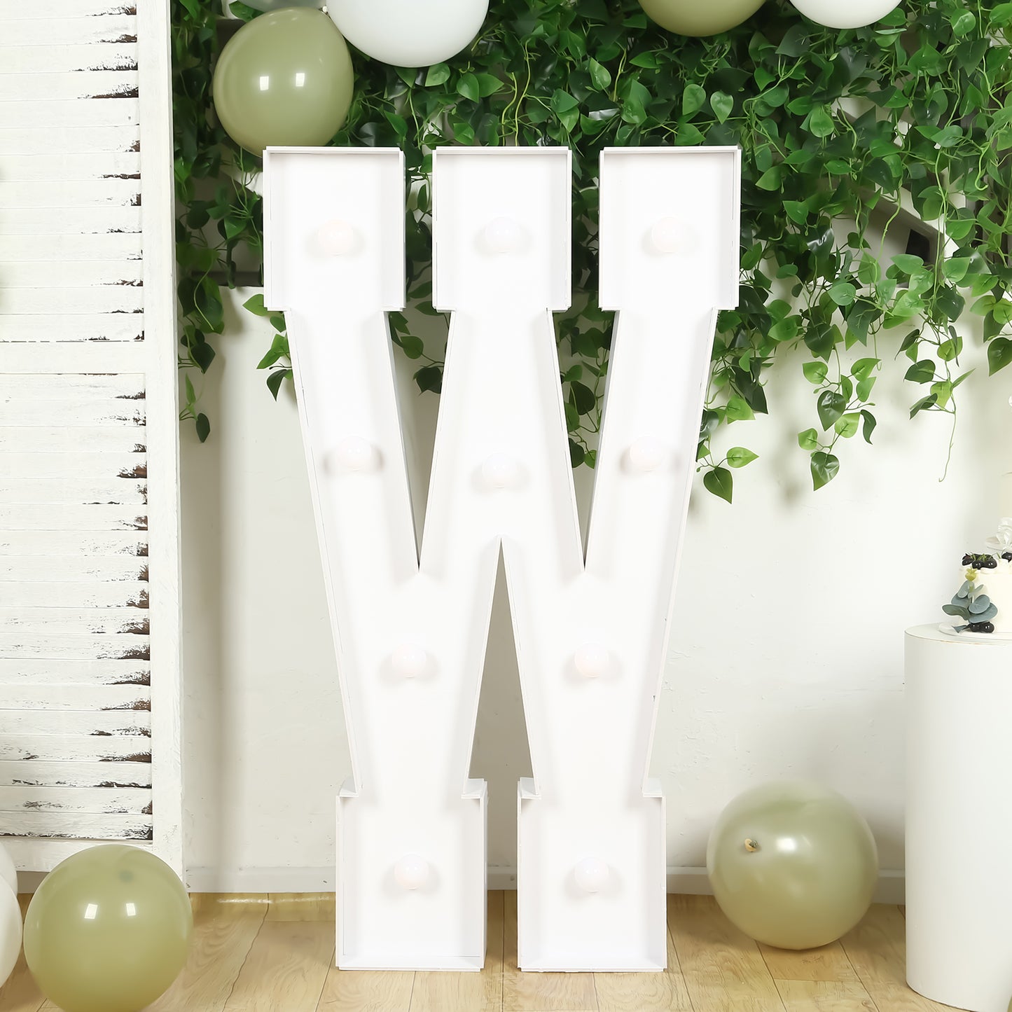 White 4ft LED marquee letter "W" with warm white lights.
