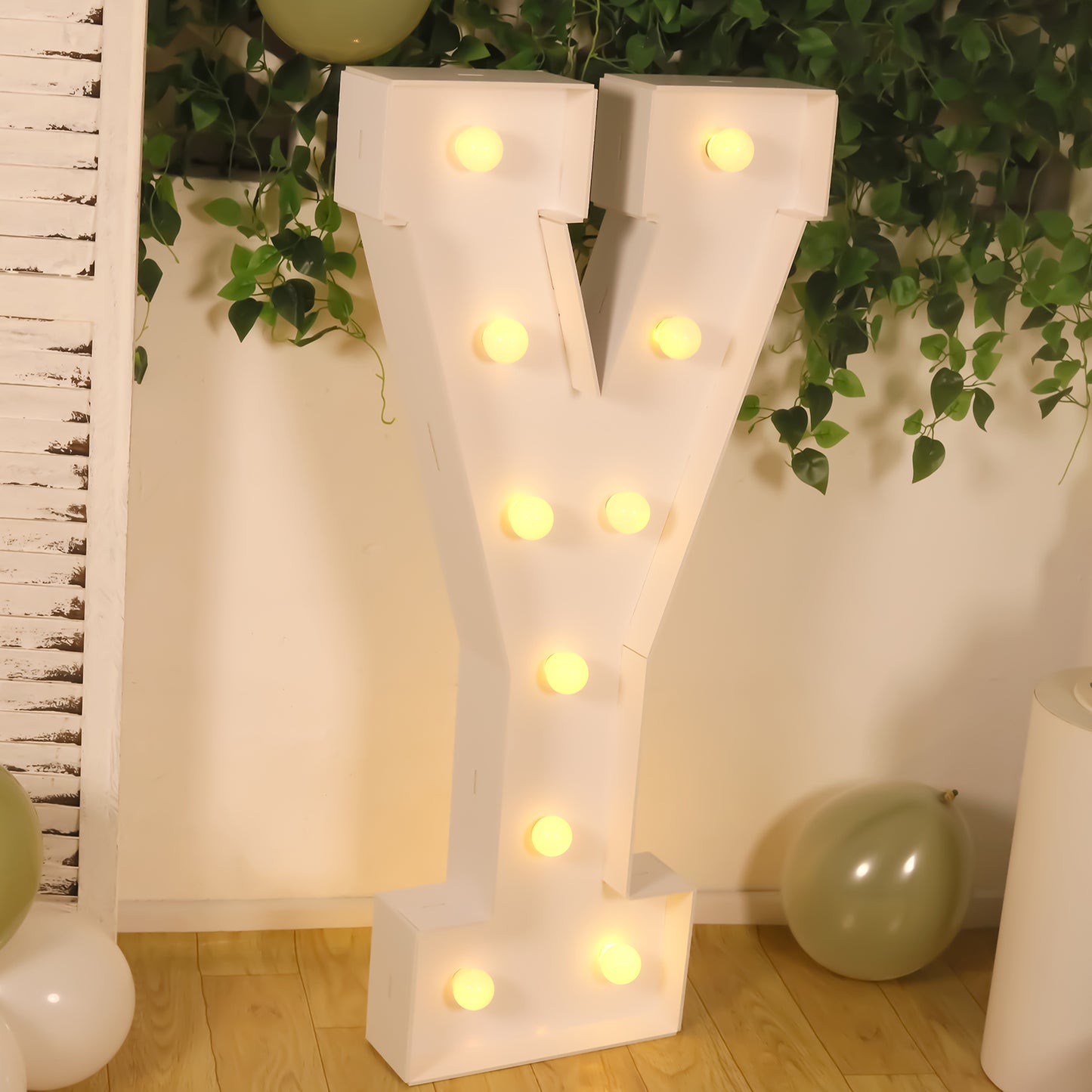 White giant LED marquee letter "Y" with warm white lights.