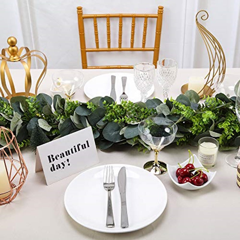 3ft Real Touch Green Eucalyptus Boxwood Leaf Garland Vine on a table setting.