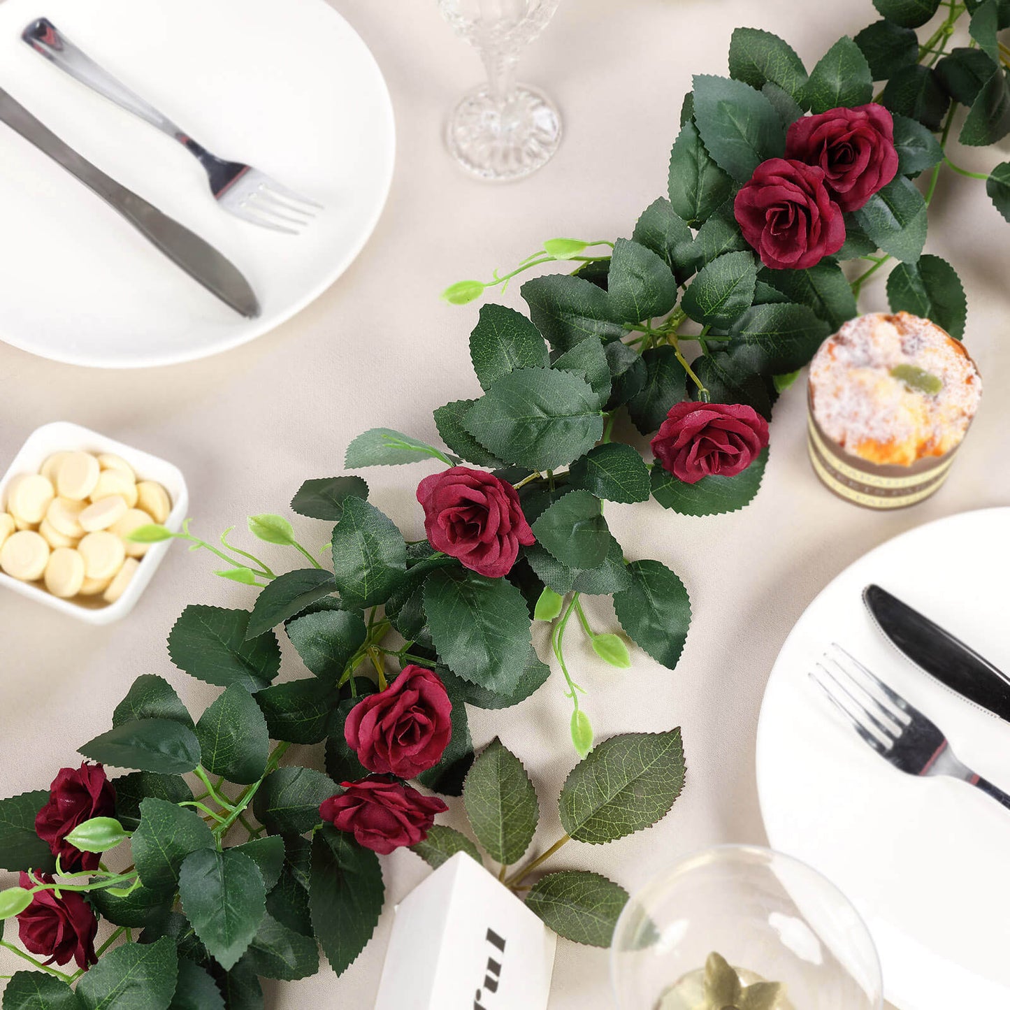 Burgundy artificial silk roses flower garland for decor.