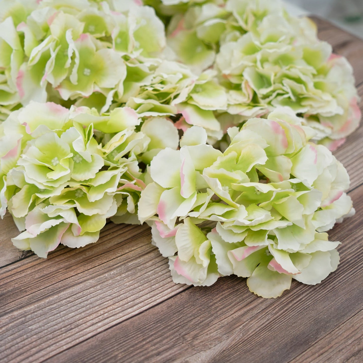 Lime and pink artificial satin hydrangeas for DIY arrangements.