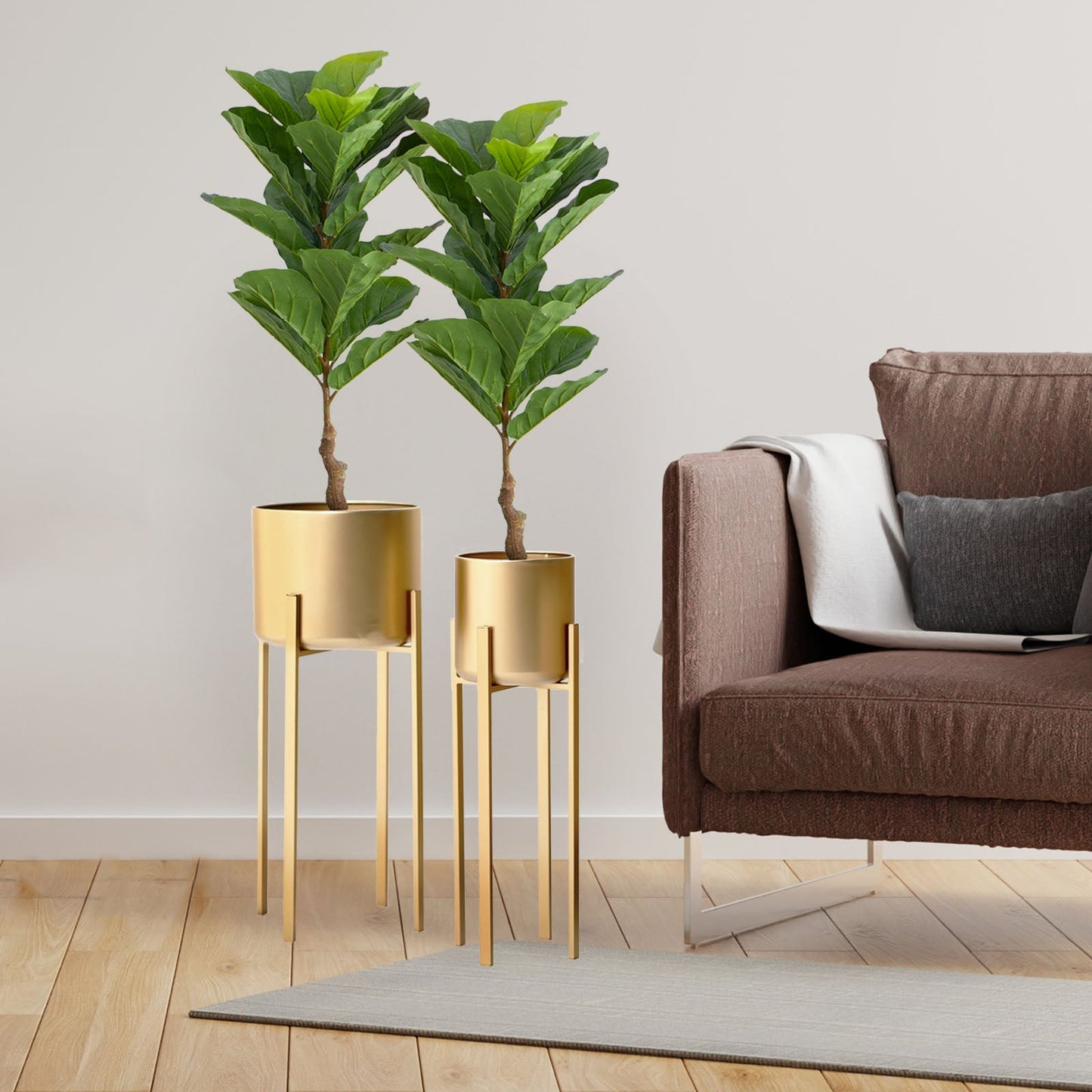 3ft green artificial fiddle leaf fig trees in gold planters.