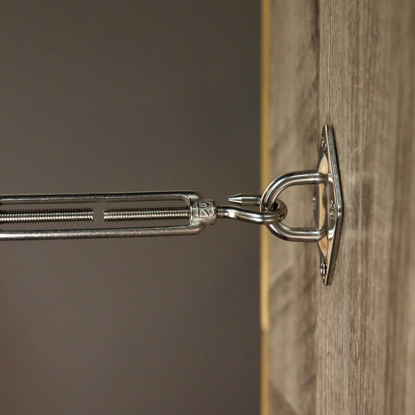 Triangle stainless steel sun shade sail installation hardware kit close-up.